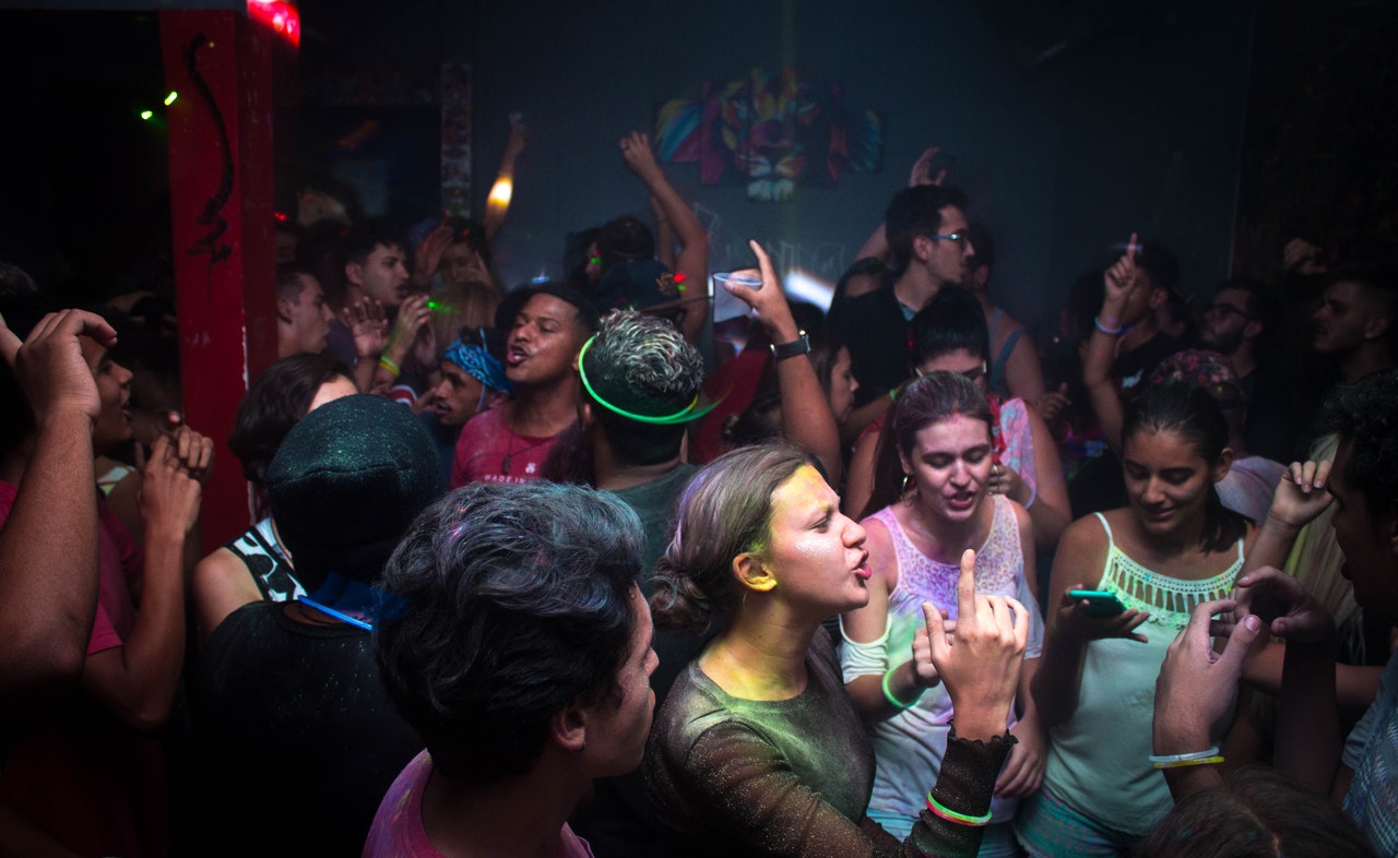 Young people dancing at house party in Trinity Bellwoods club. 