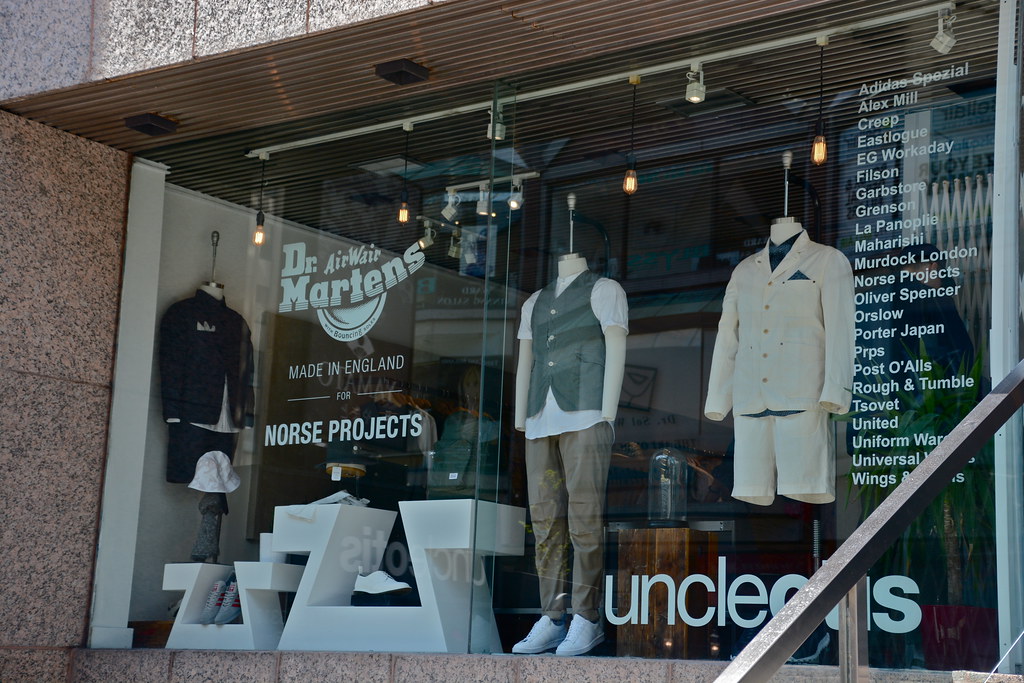 Storefront display of stylish male mannequins in Yorkville, Toronto.