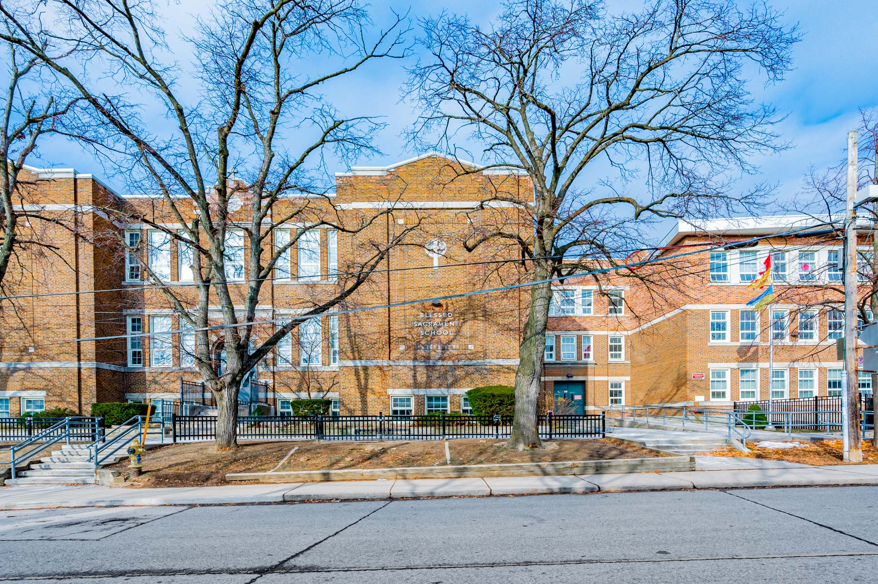 Beige brick exterior of Blessed Sacrament Catholic School.