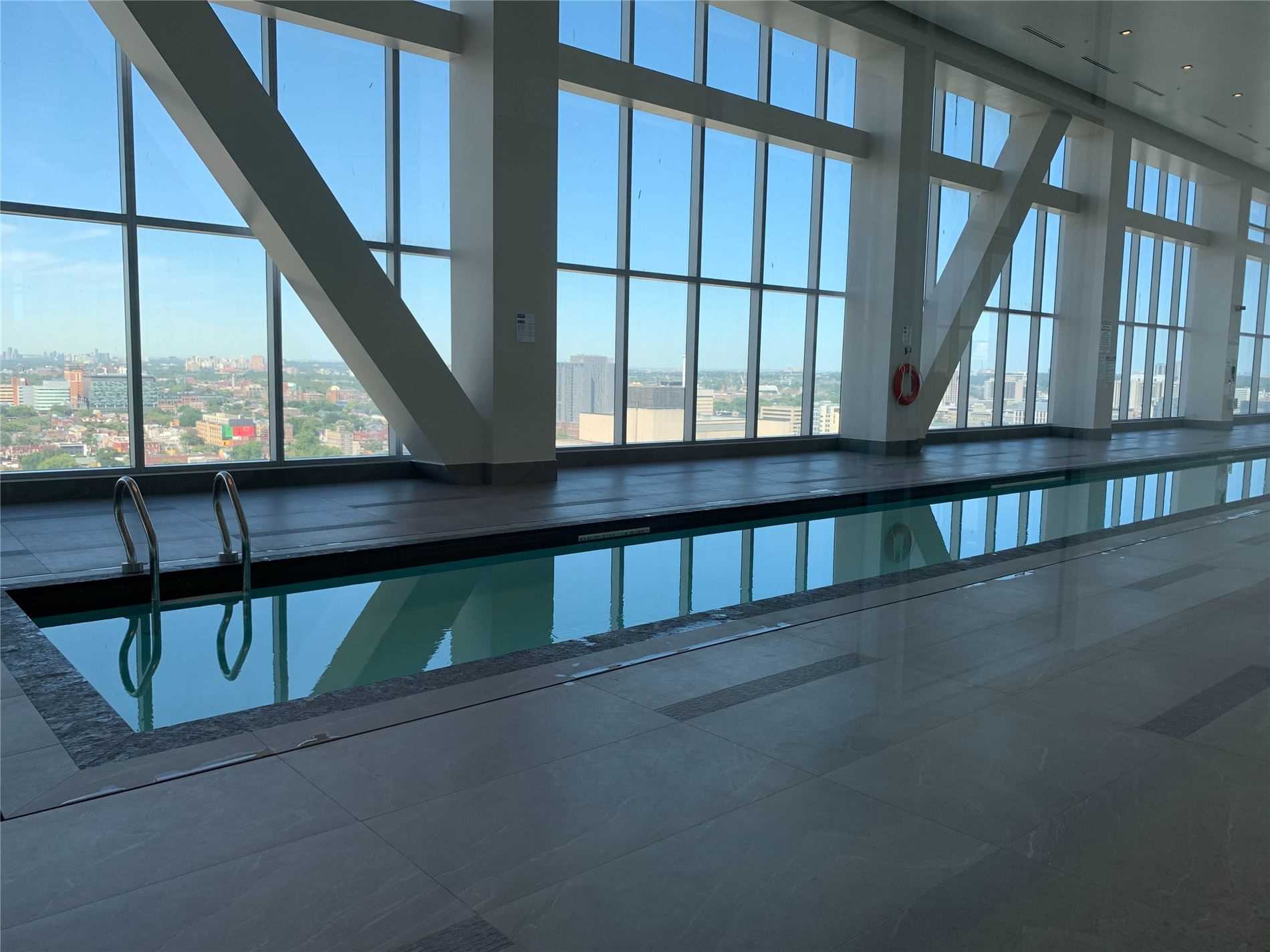 Long swimming pool at The Residences of 488 University Avenue.