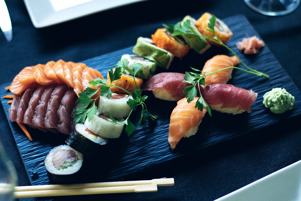 Sushi platter with shrimp and garnish.