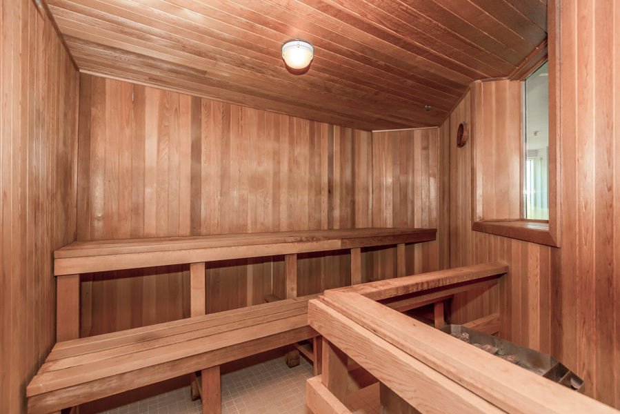 Sauna with wood panelling and benches in the Bellagio on Bloor.