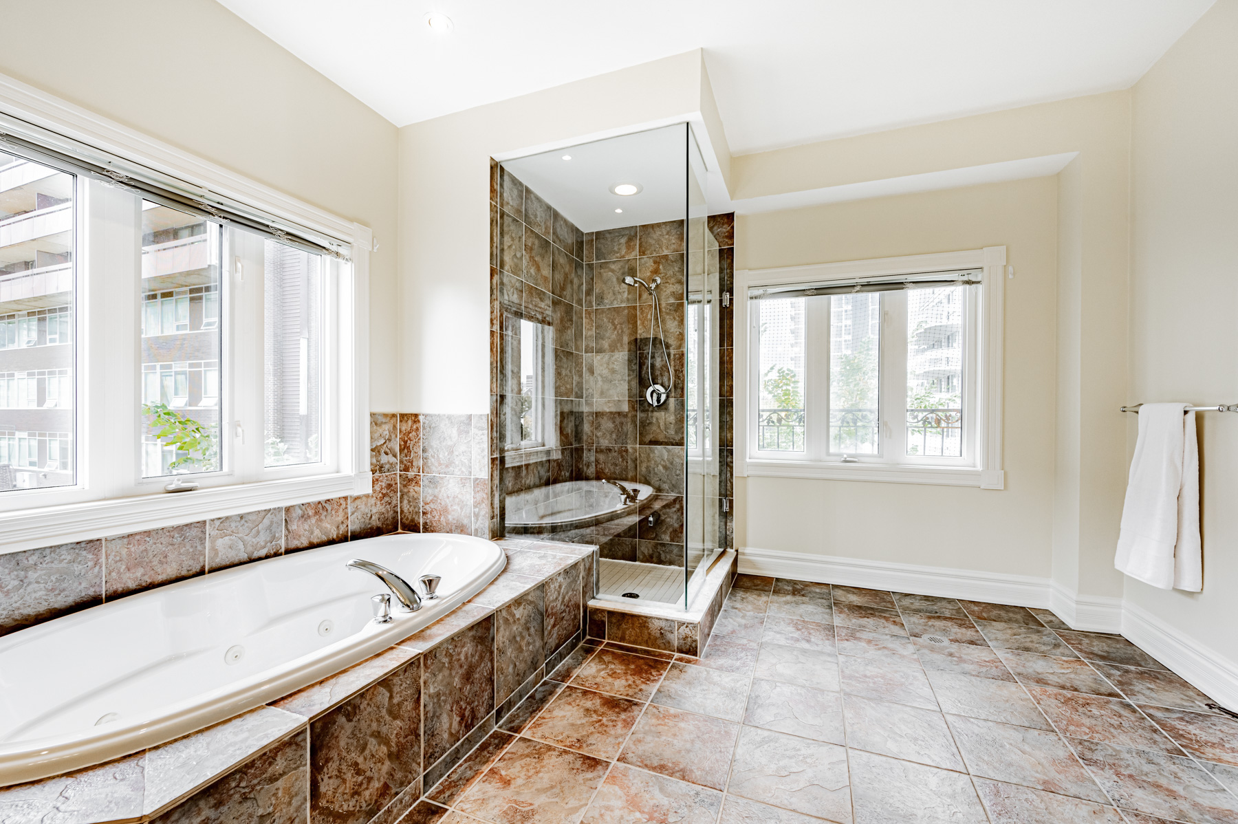 Bathroom Jacuzzi with nearby window.