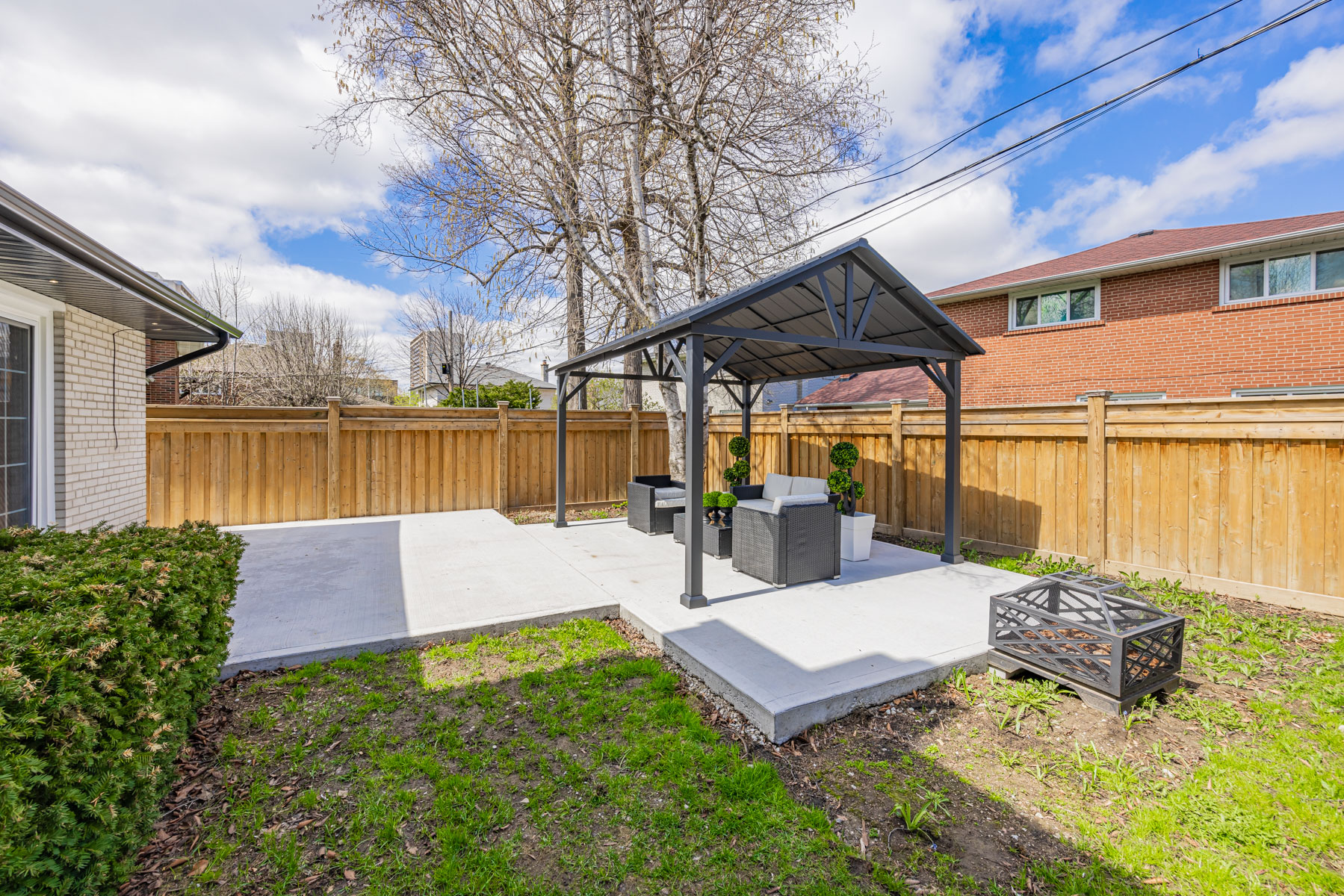 Steel pavilion and gazebo with seating and table.