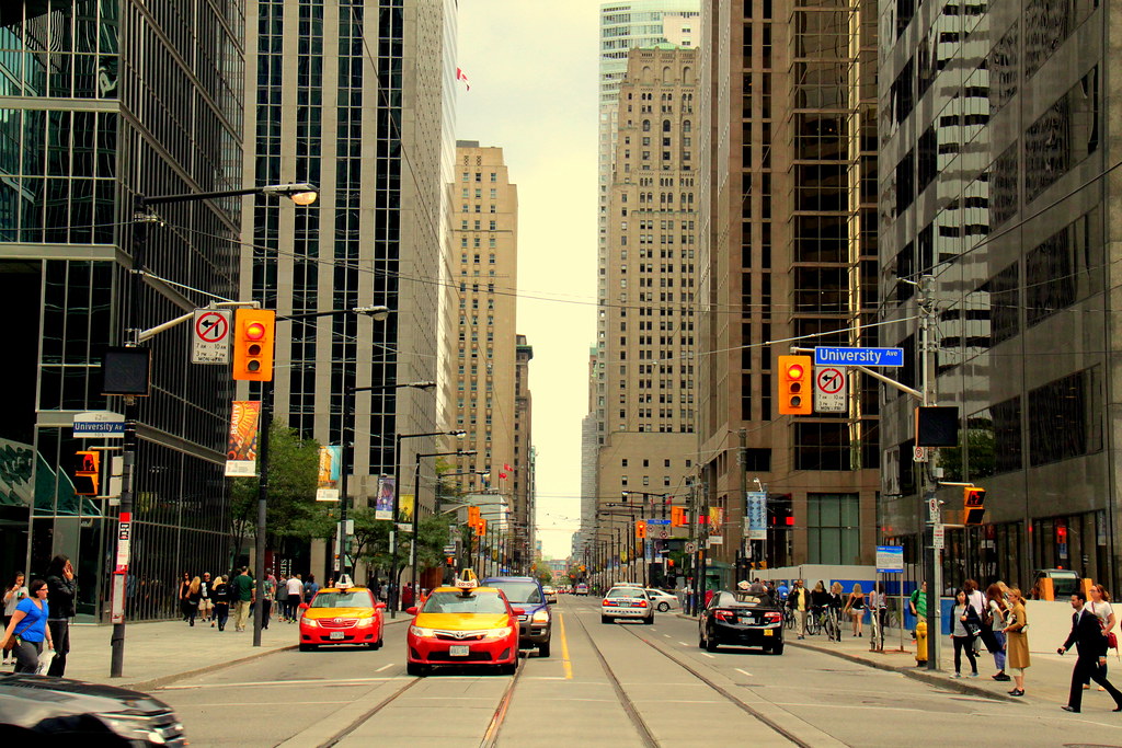 People and cars on University Avenue in Toronto.