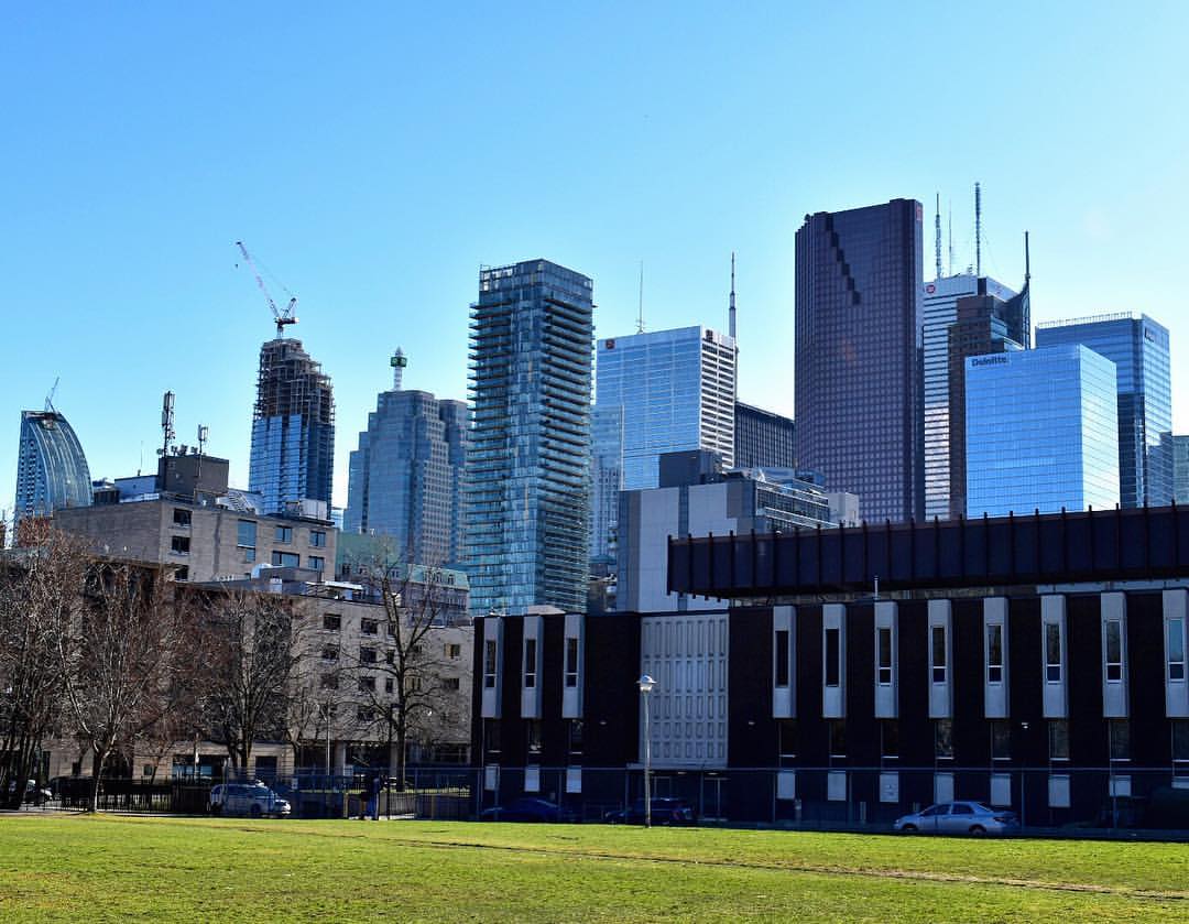 Construction of condos in Toronto's Financial District seen from Moss Park.
