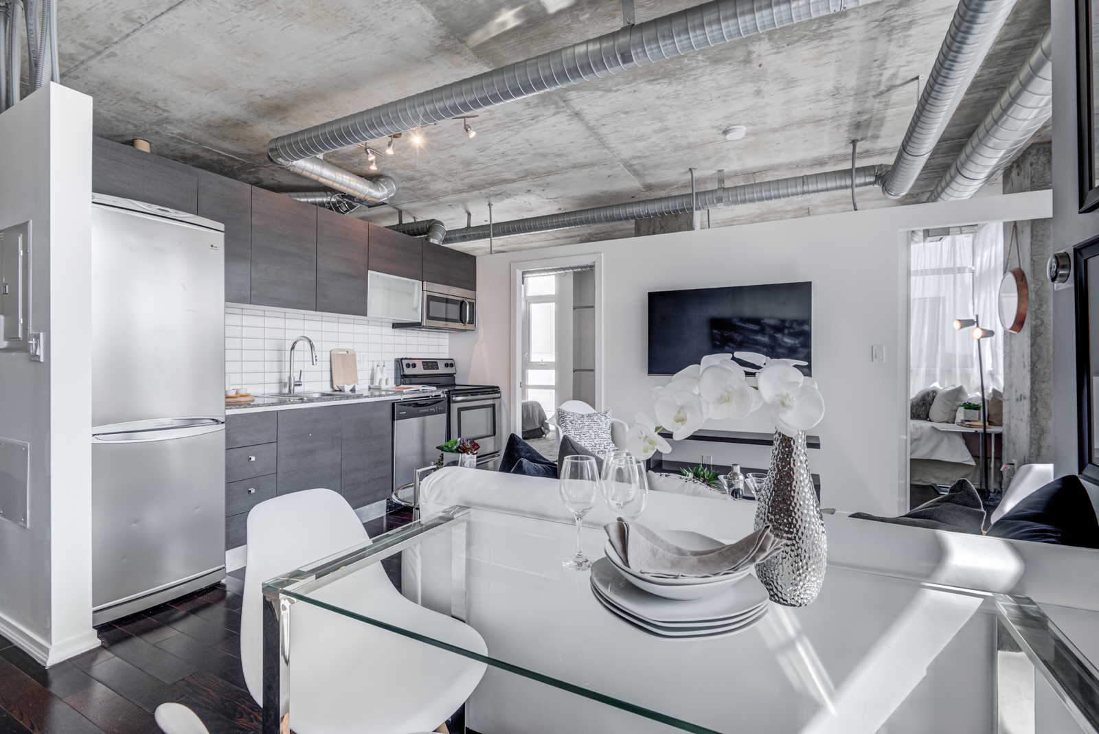 Dining room, living room, kitchen and hallway shot of 150 Sudbury St Unit 511.