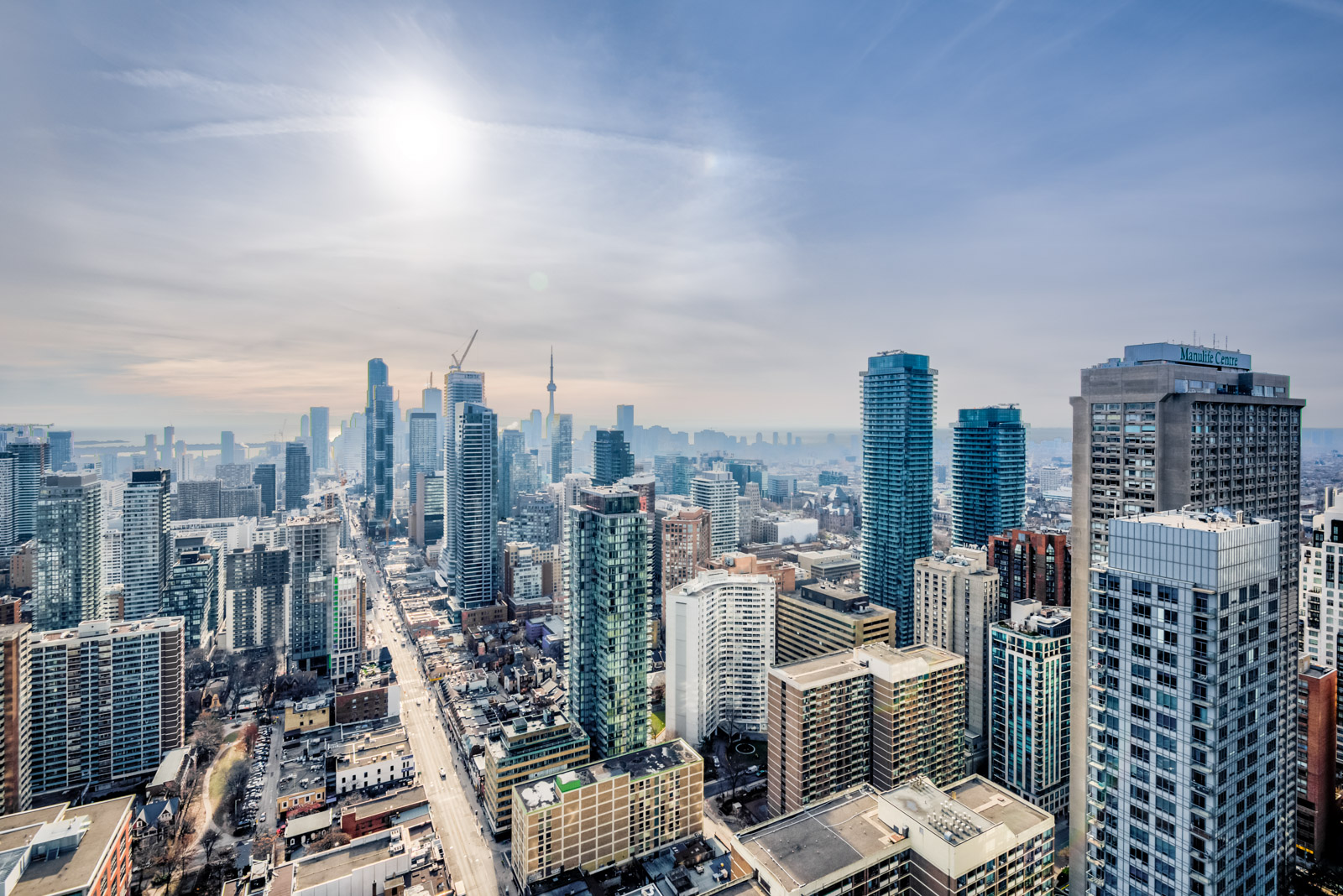 Morning; Toronto skyline showing CN Tower and streets of Yonge and Bloor.