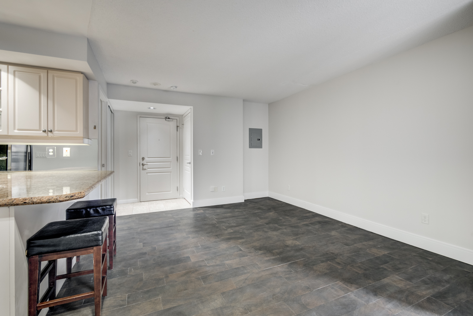 View of 140 Simcoe St E Unit 901 empty living room and bedroom.