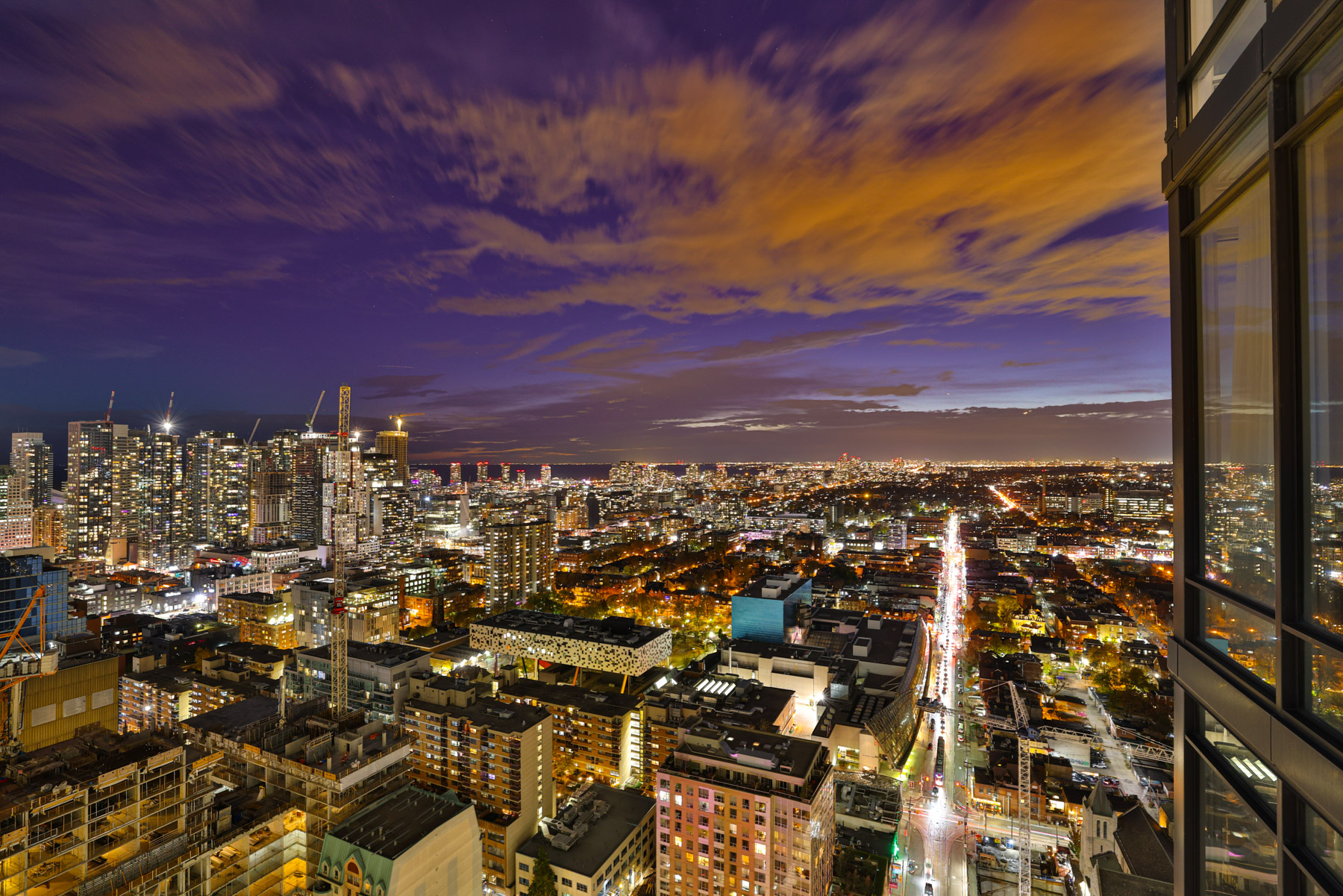 Brightly lit downtown Toronto at night.