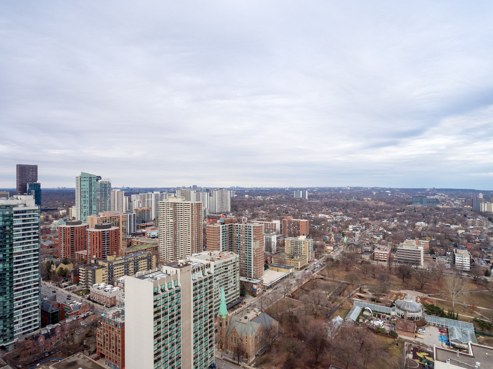 Aerial view of Church-Yonge Corridor during winter with buildings and parks.