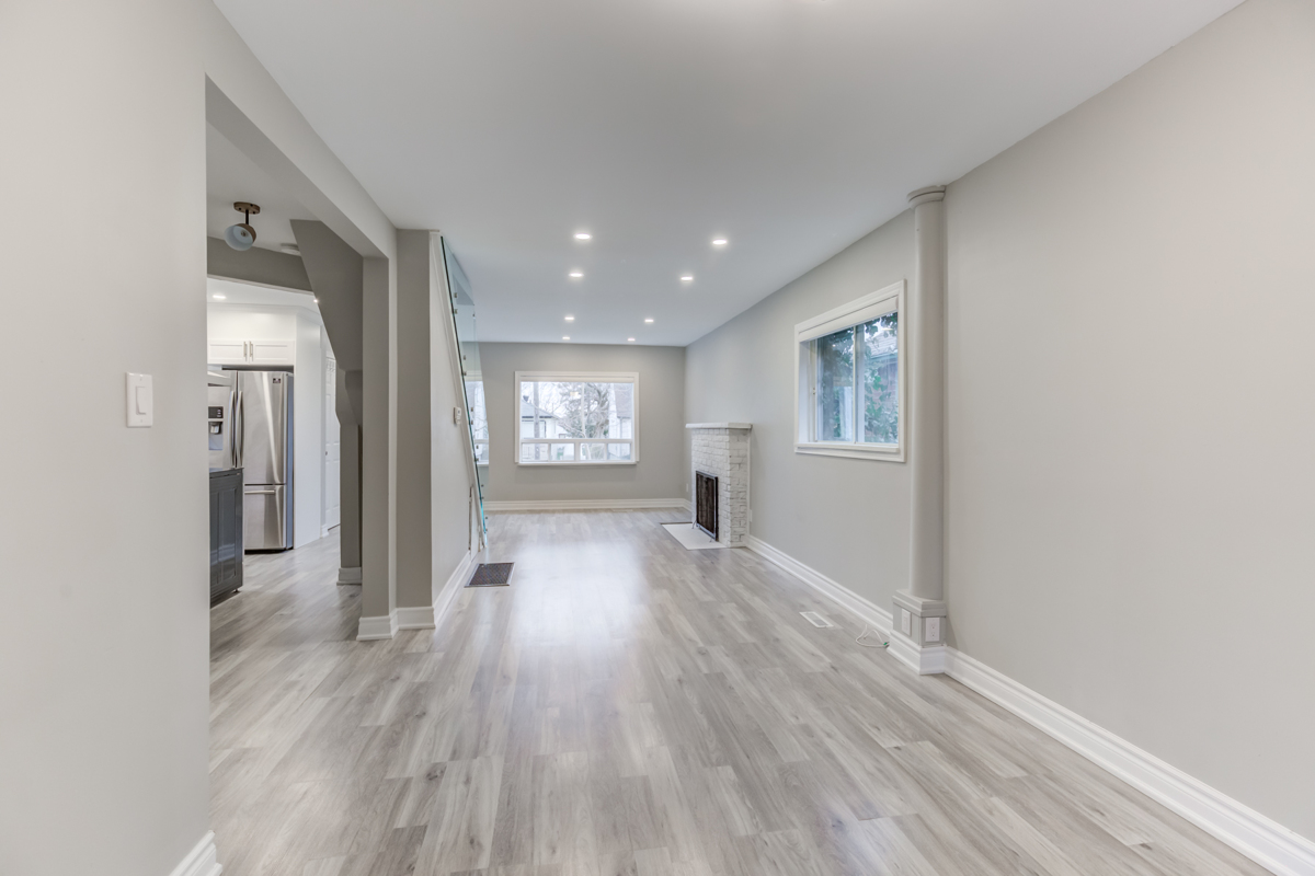 54 Huntington Ave – brightly lit house with pot-lights, fireplace and large windows.