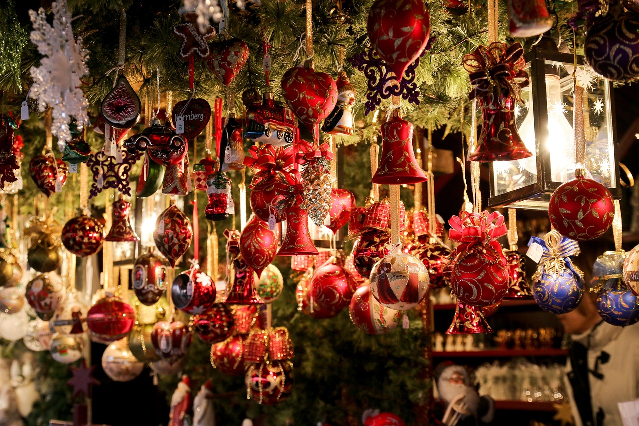 Hanging Christmas ornaments at market.