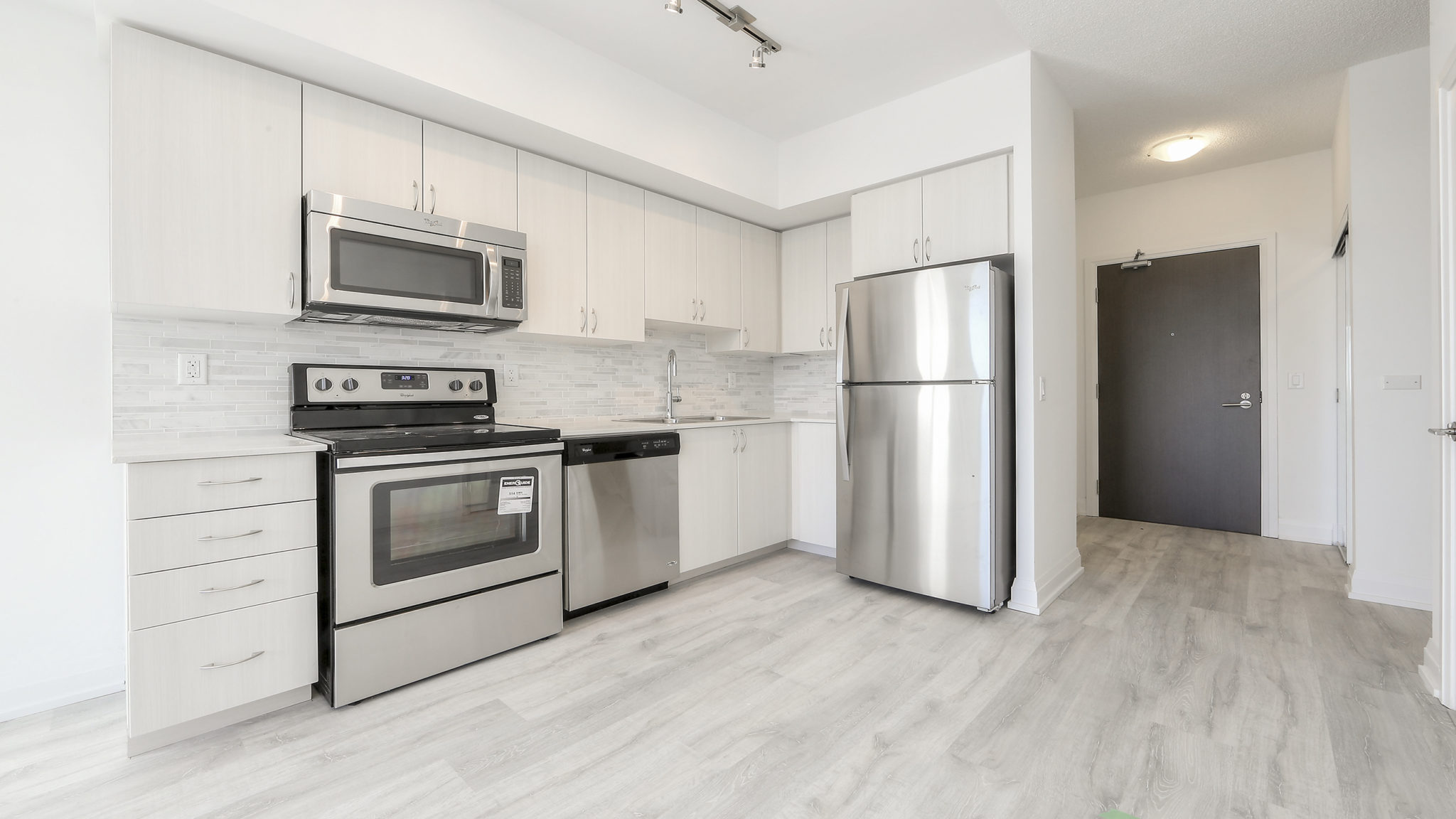 Photo of kitchen with the same mix of white and light colours.