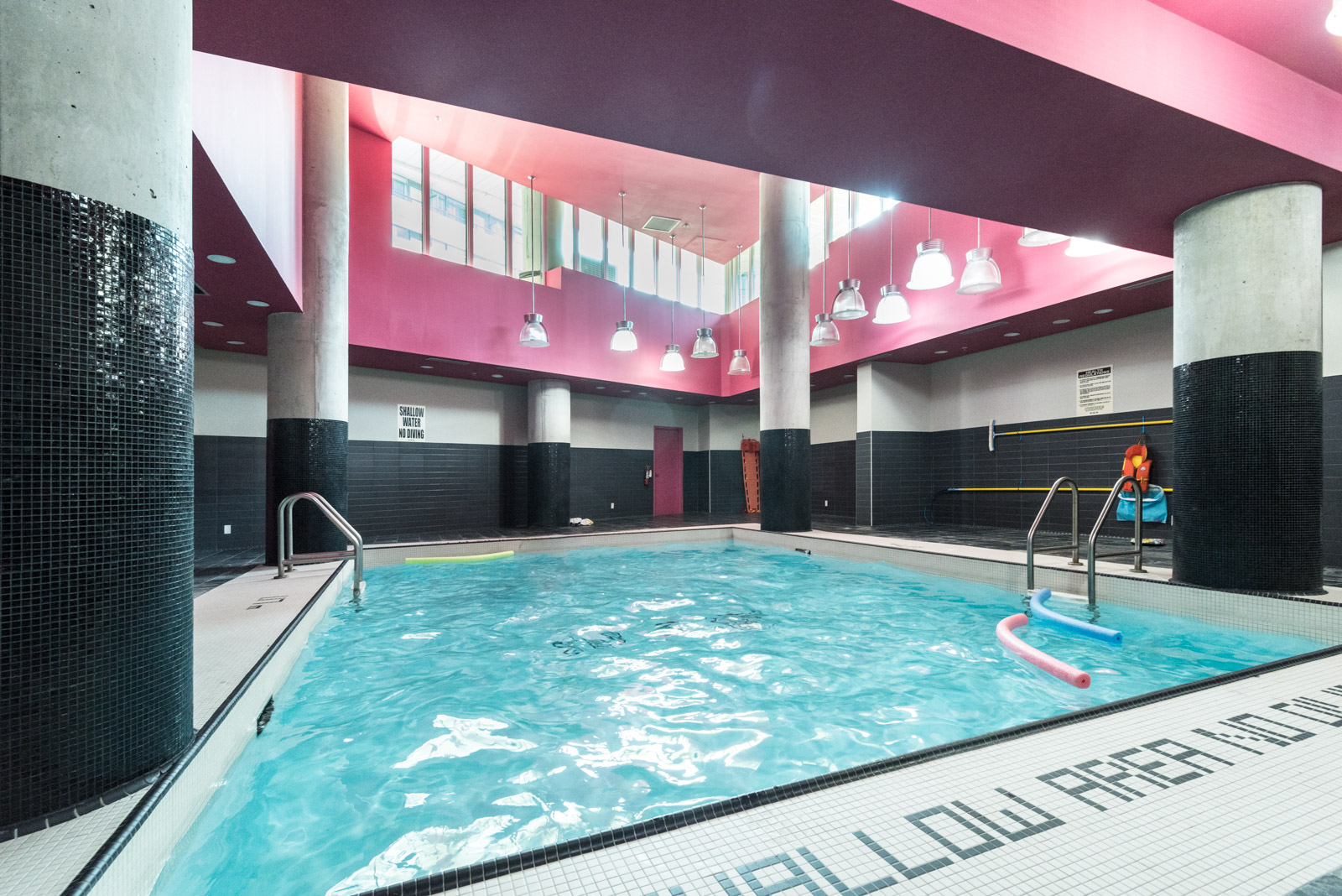 Here we see the condo pool and its sparkling blue water and rather pinkish walls.