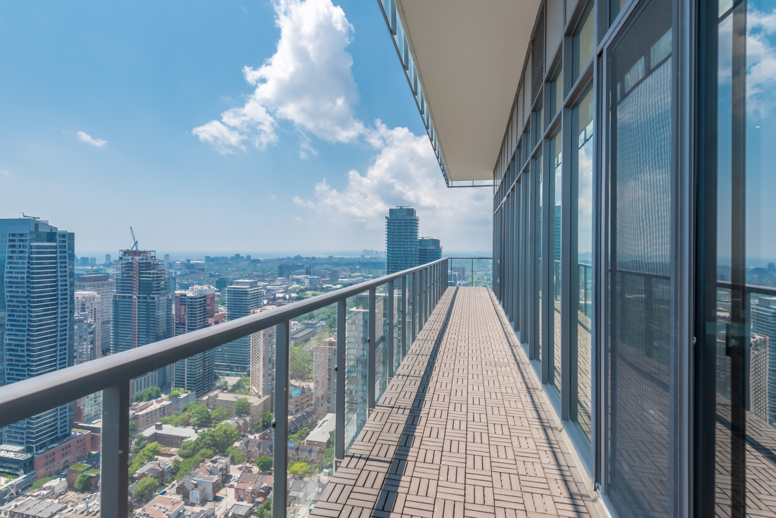 Image of balcony: it's so long and shows a rather lovely view of Toronto.