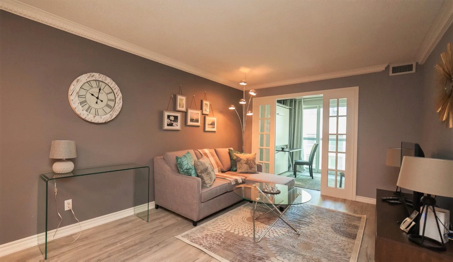 168 Simcoe Unit 1013 living room with stylish lighting and furniture.