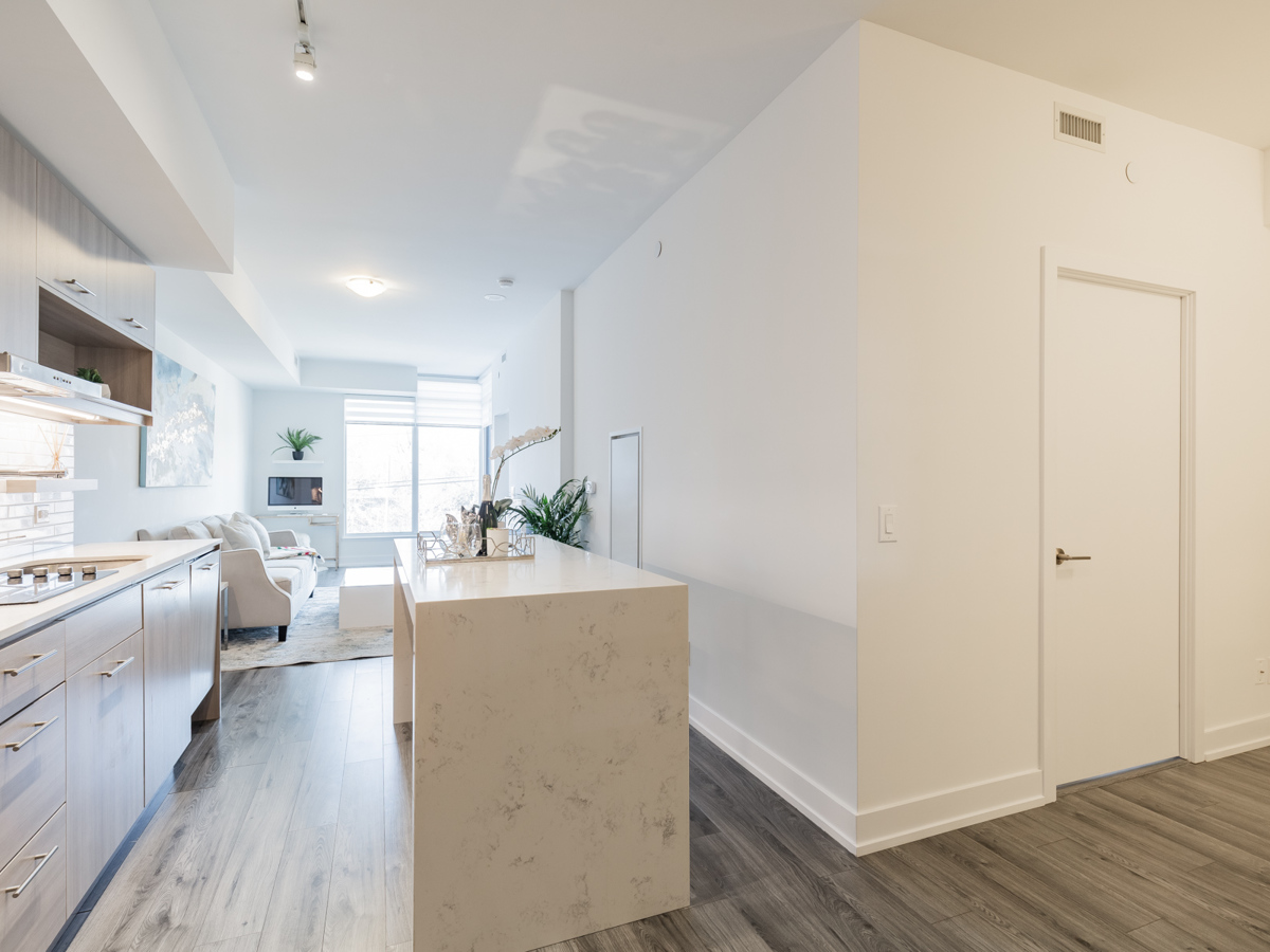 170 Chiltern Hill Rd Unit 410's brightly lit kitchen and living room.