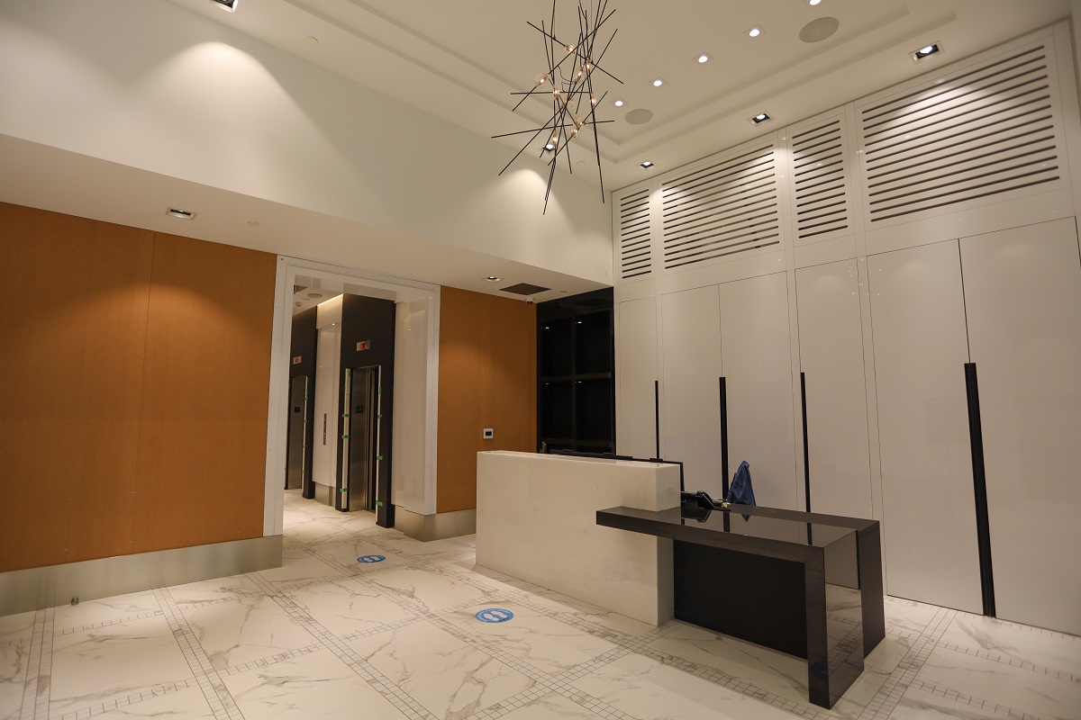 Stanley Condos lobby with chic light-fixture.