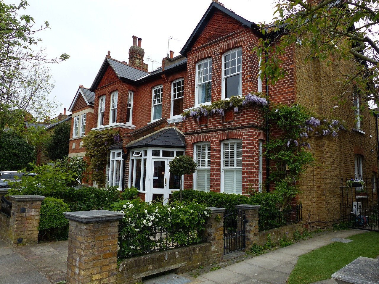 Victorian-era house with red-brick facade.