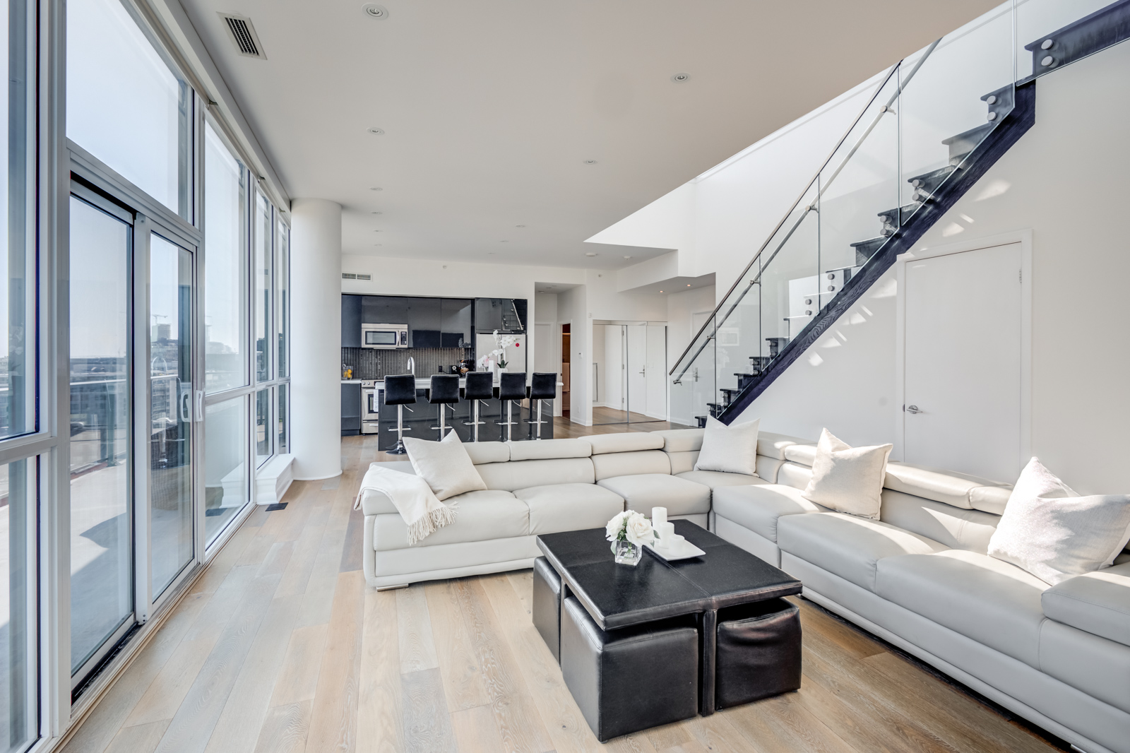 Living room and kitchen photo of Victory Lofts - 478 King St W Toronto Penthouse Suite