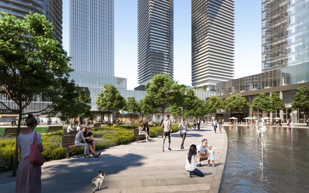 Image of people, trees and fountain at Sugar Wharf.