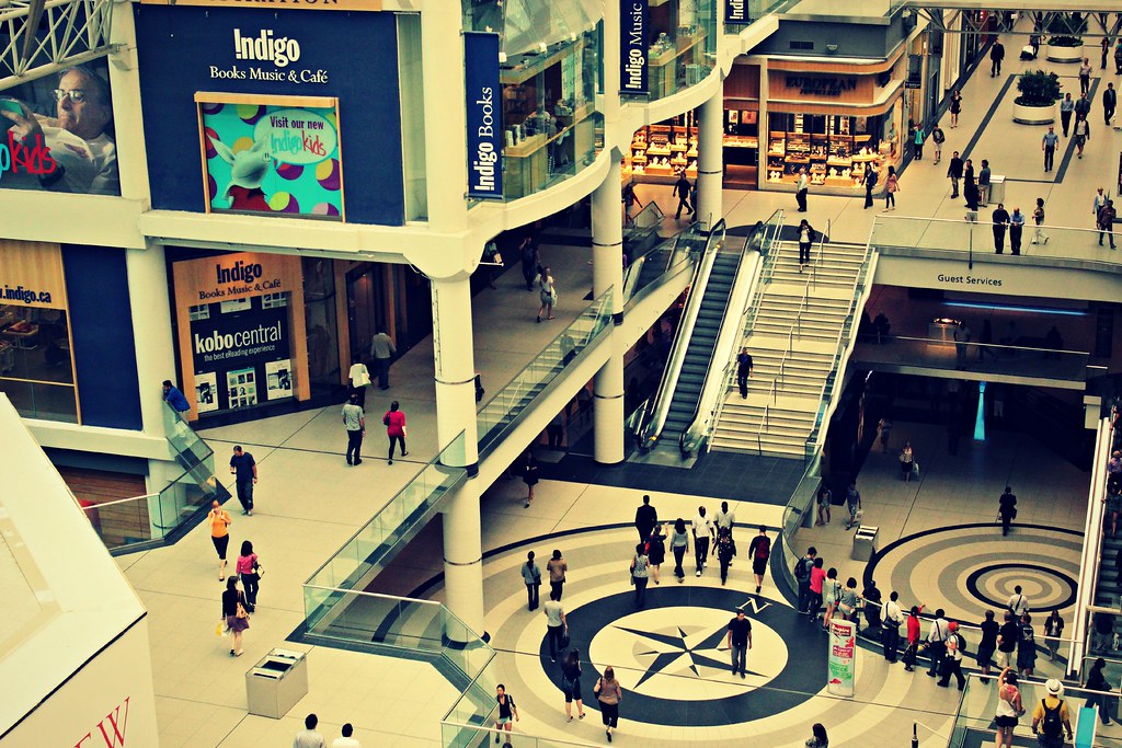 Top-down view of stores and shoppers at Eaton Centre in Toronto.