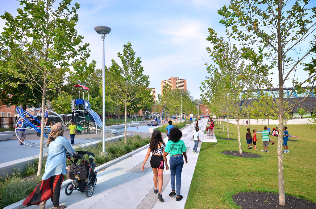 3D render of mothers and children at playground in Toronto's Regent Park.