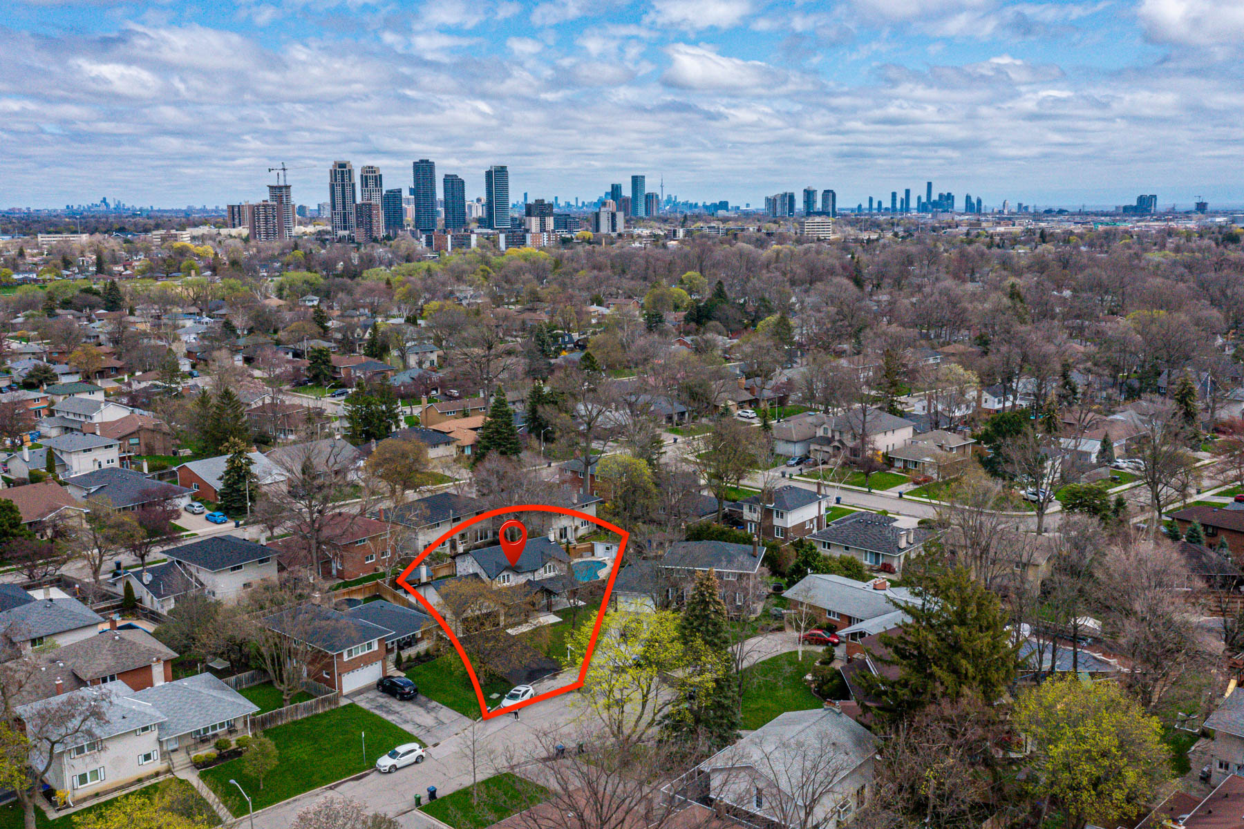 Aerial photo of suburban Markland Wood with Toronto in distance.