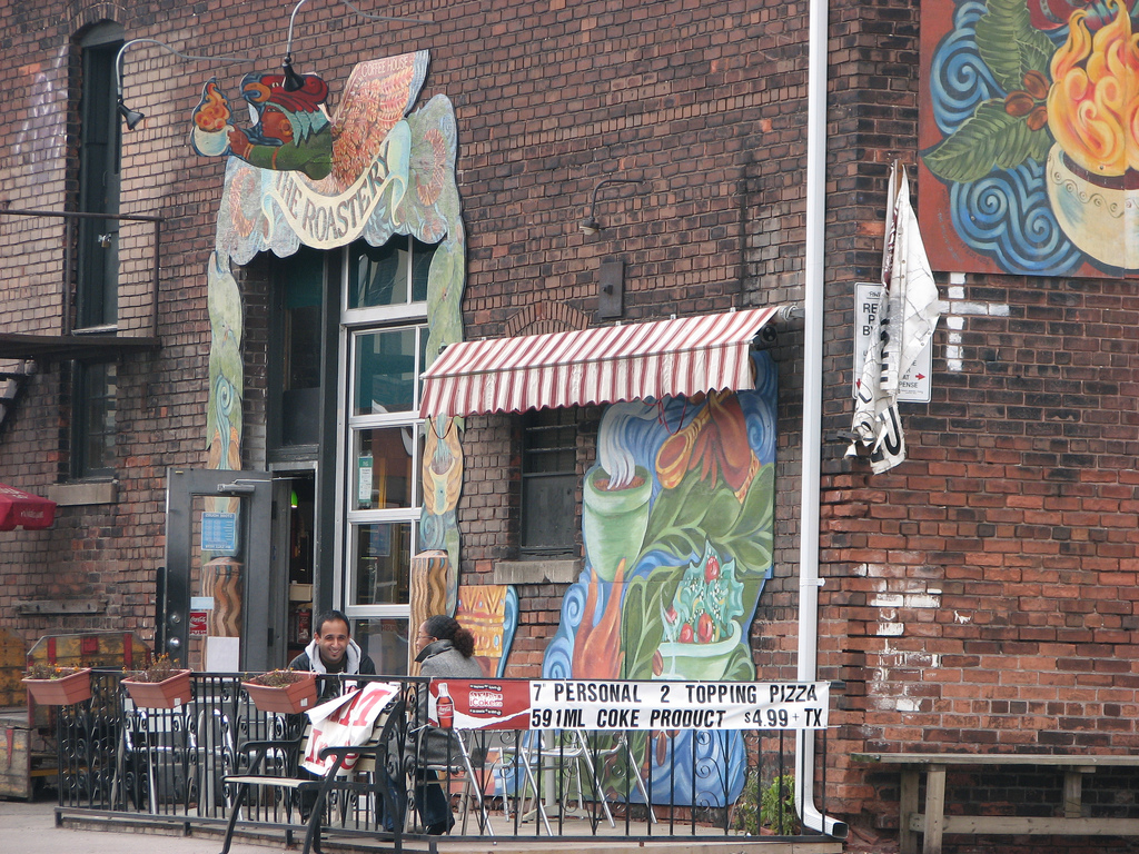 A photo of a cafe and painted walls.