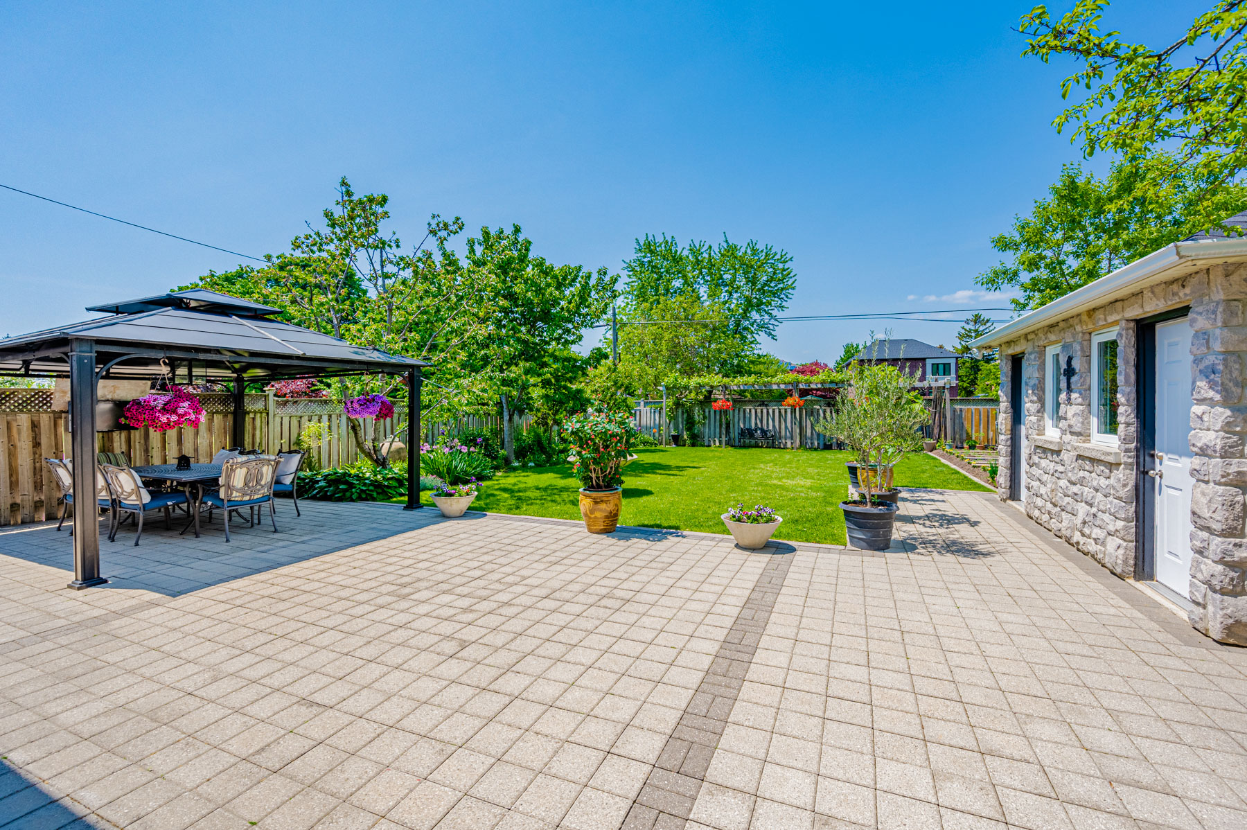 Backyard with steel pavilion.