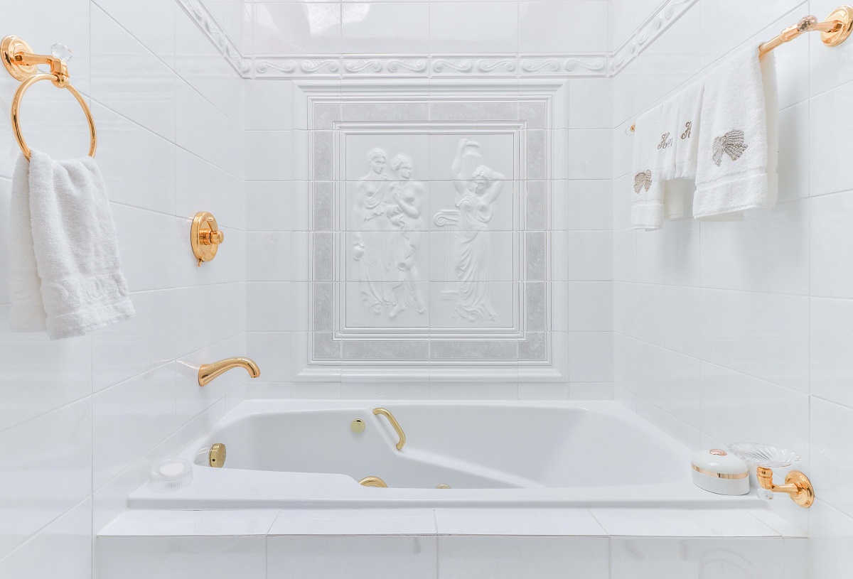 White soaker tub and tiled artwork at 6 Parmbelle Cres.