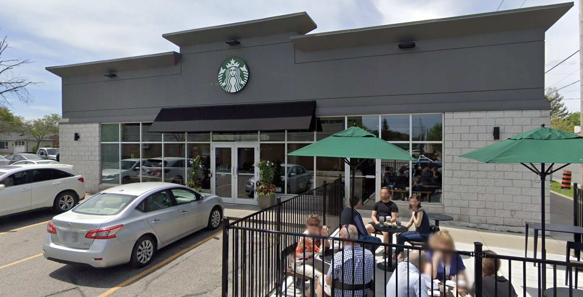 People sitting at Starbucks patio.