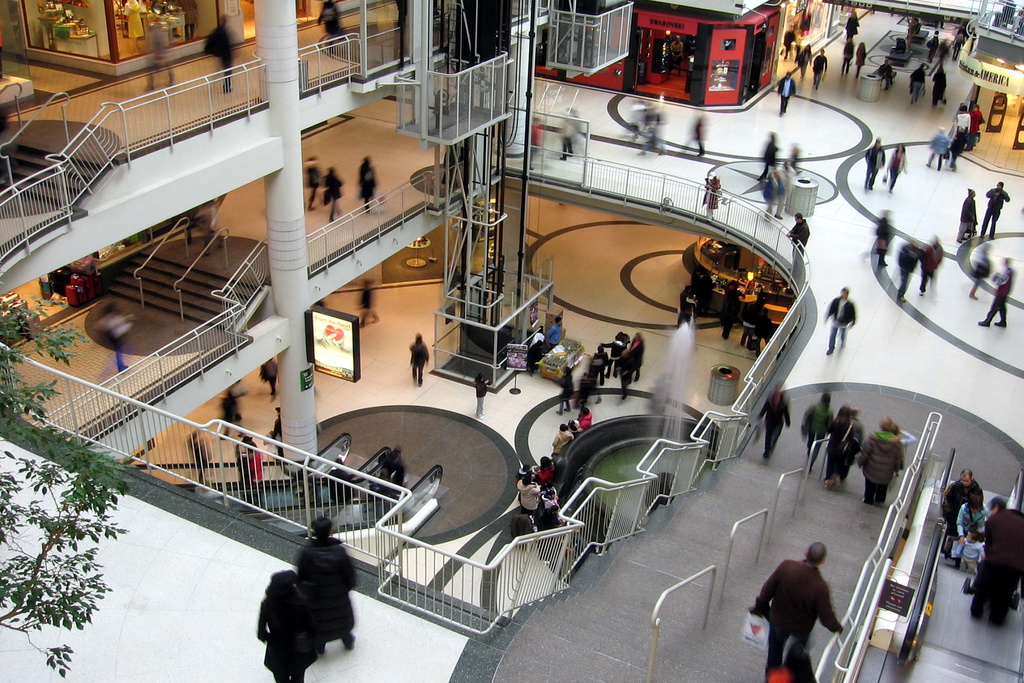 View of Eaton Centre looking down. It seems like many of the people are blurred.