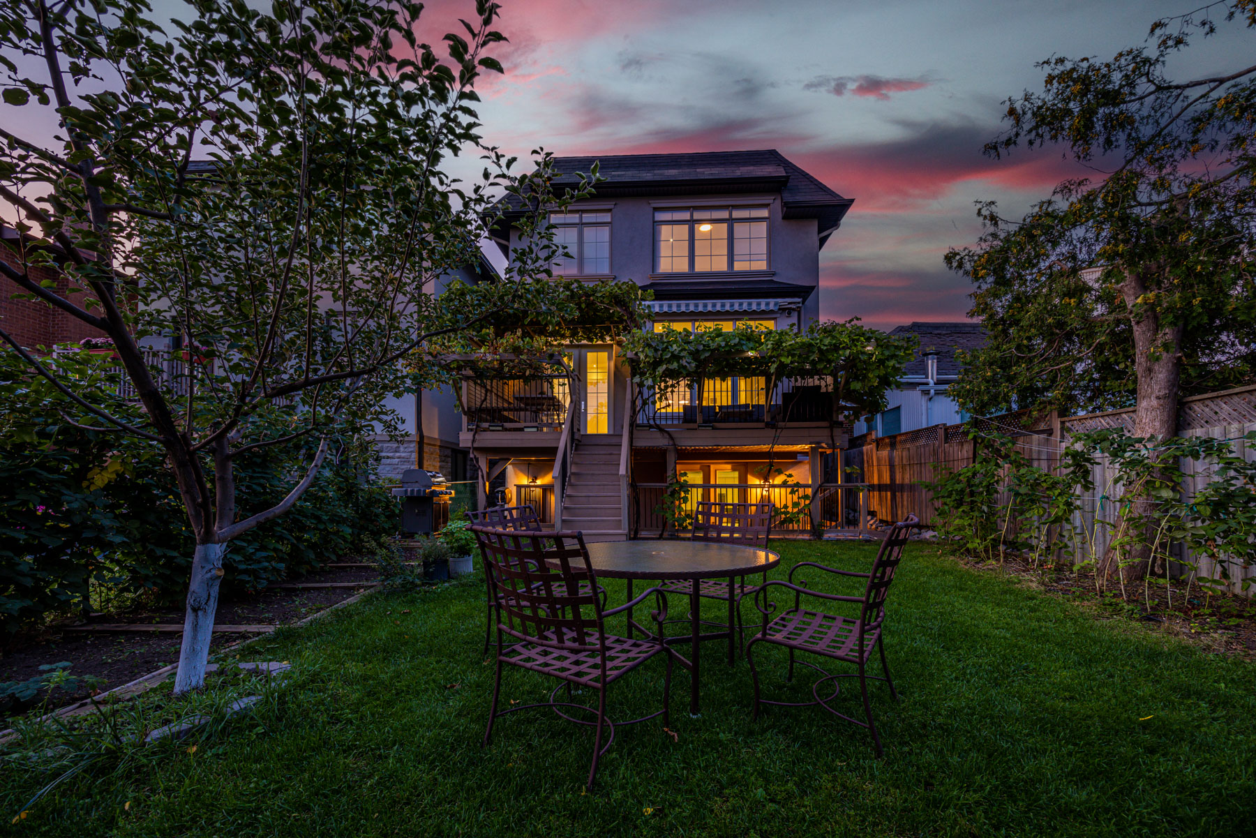 Romantic sunset view of 741 Glencairn Ave backyard.