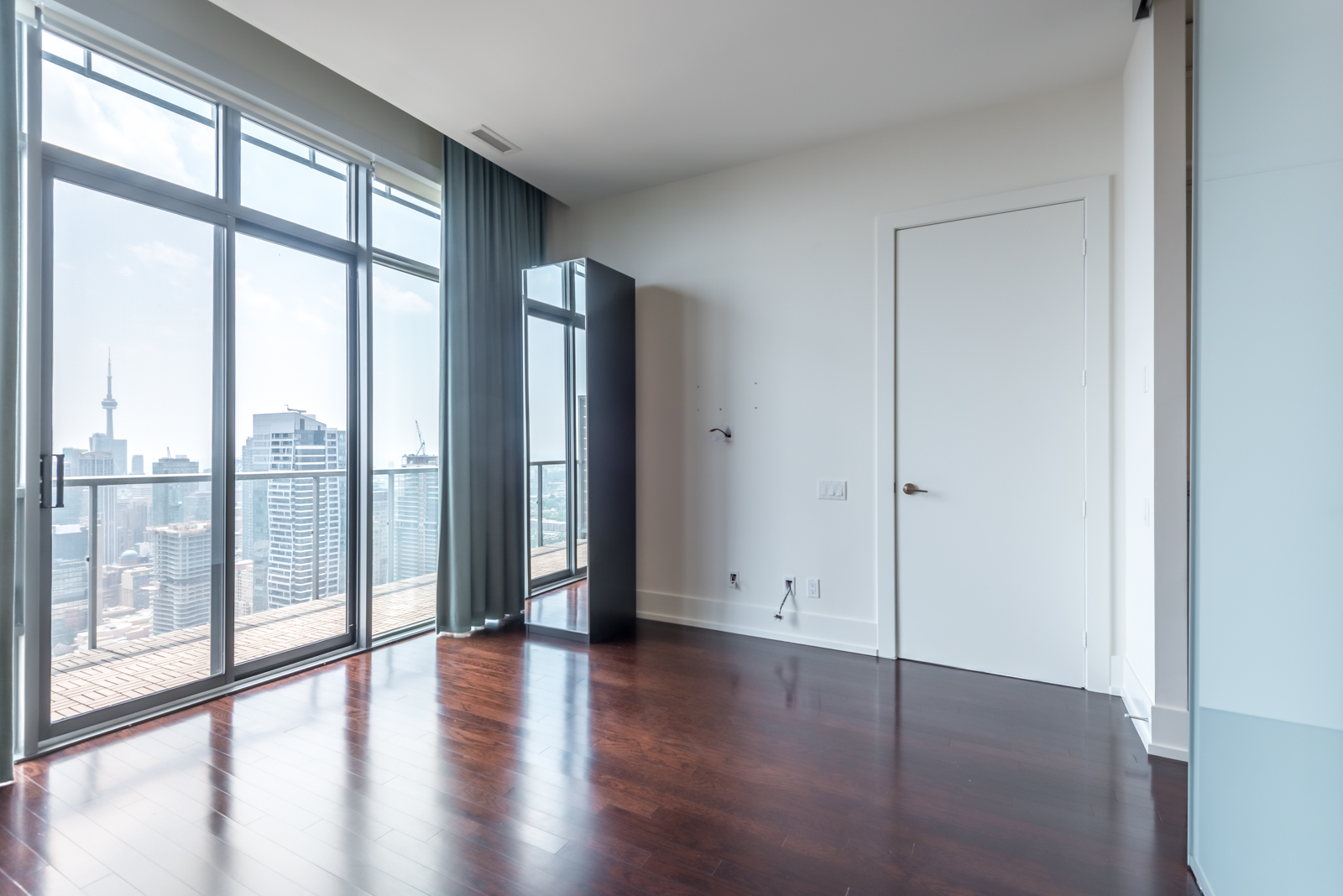 View of master bed and balcony.