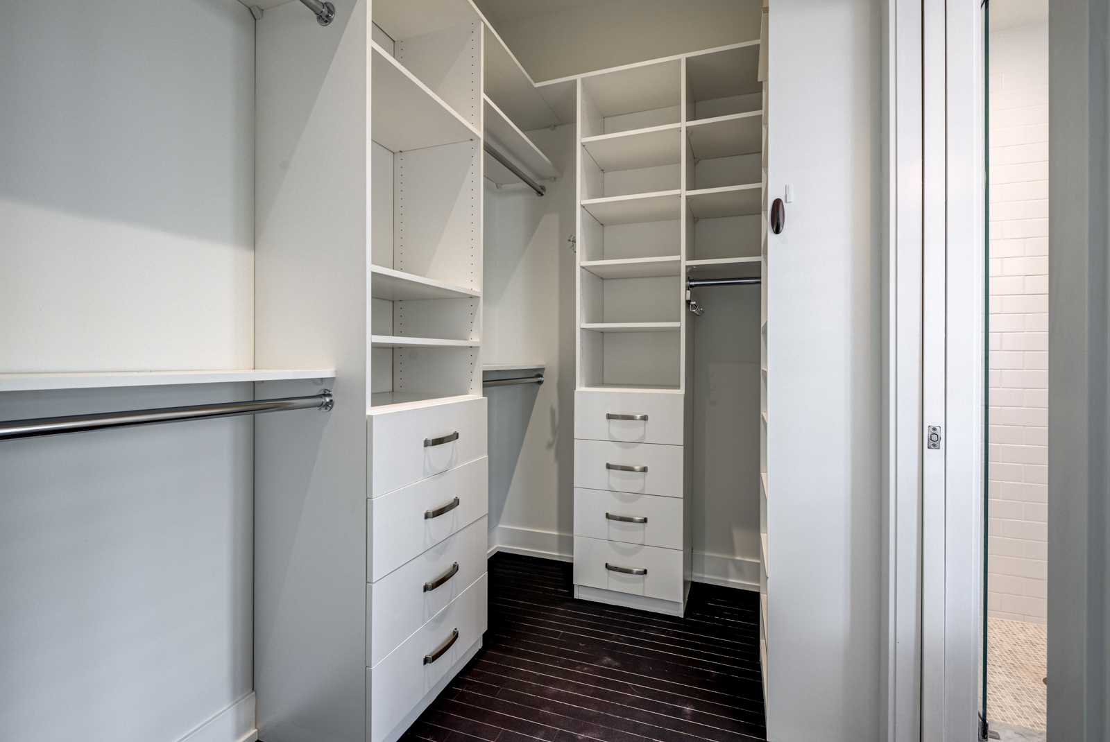 Walk in closet of 12A Cecil master bedroom with empty shelves