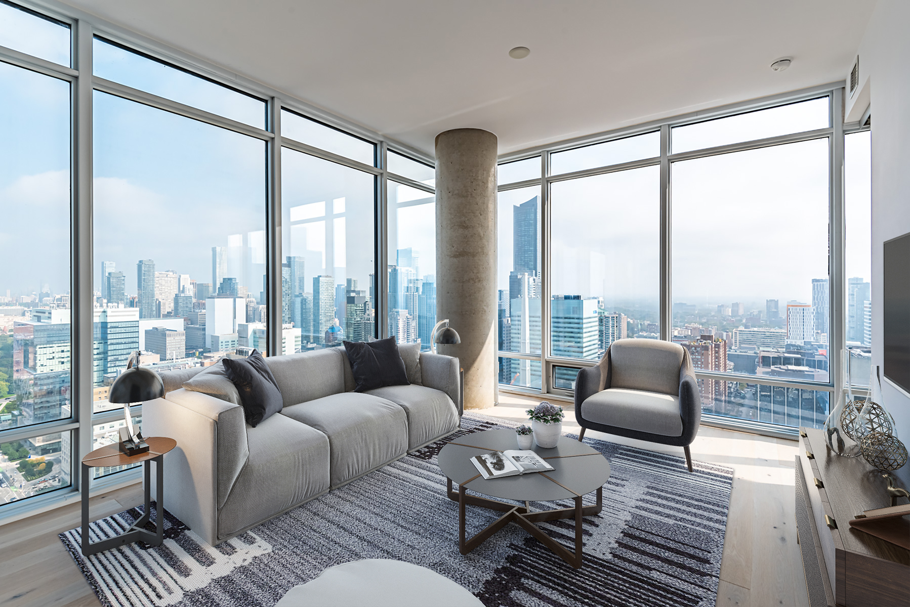 488 University Ave living room with glass walls and view of Toronto.