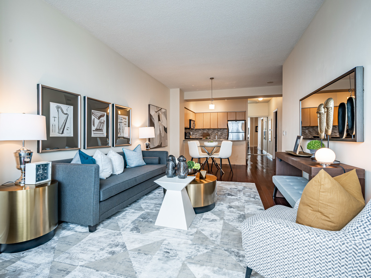 View of spacious living room, dining room, kitchen and hallway.