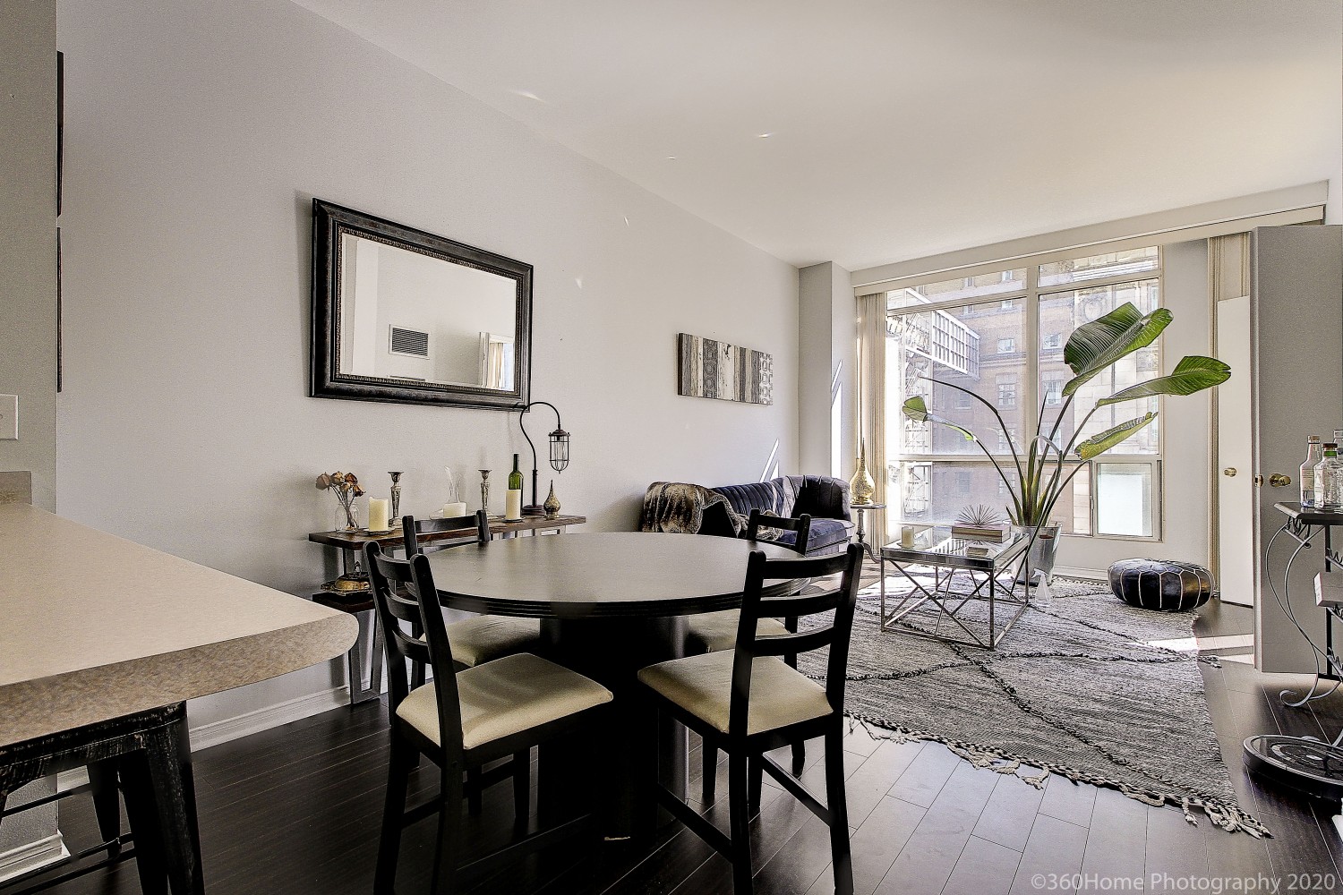 View of 7 King St E Unit 817 open-concept dining room and living room.