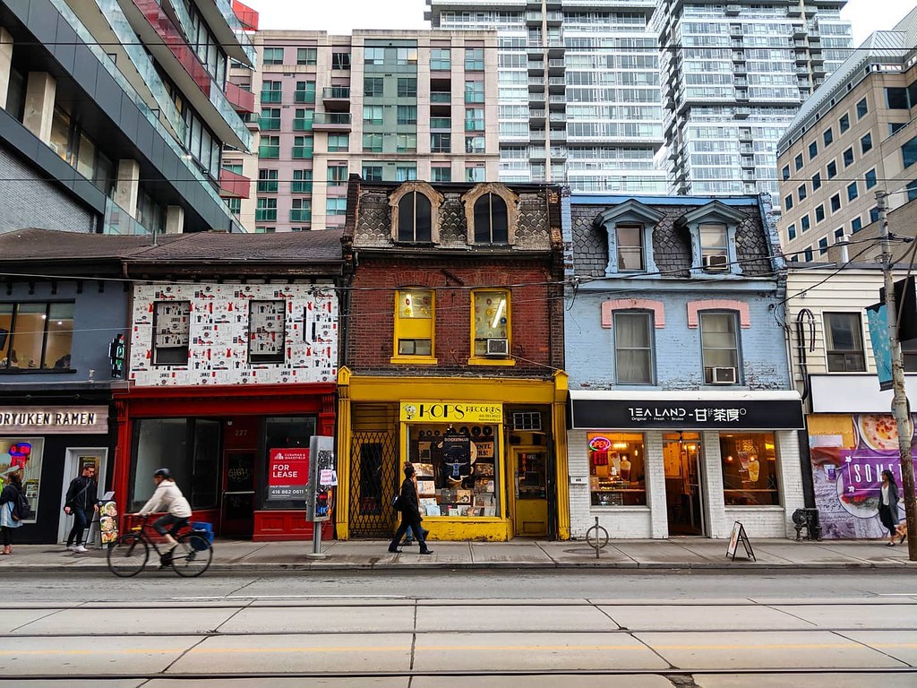 Small, colourful storefronts in Trinity Bellwoods Toronto. 