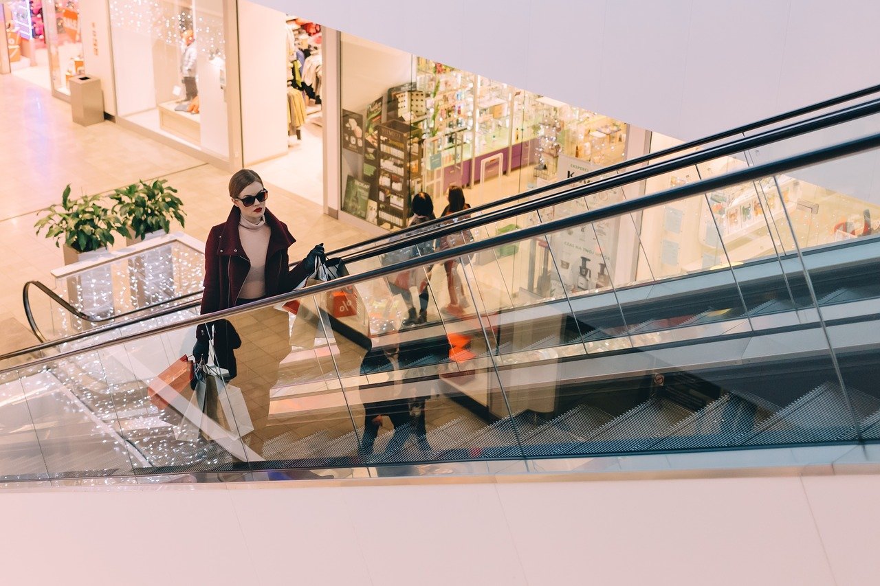 Young woman on mall escalator in Dovercourt Wallace Emerson Junction.