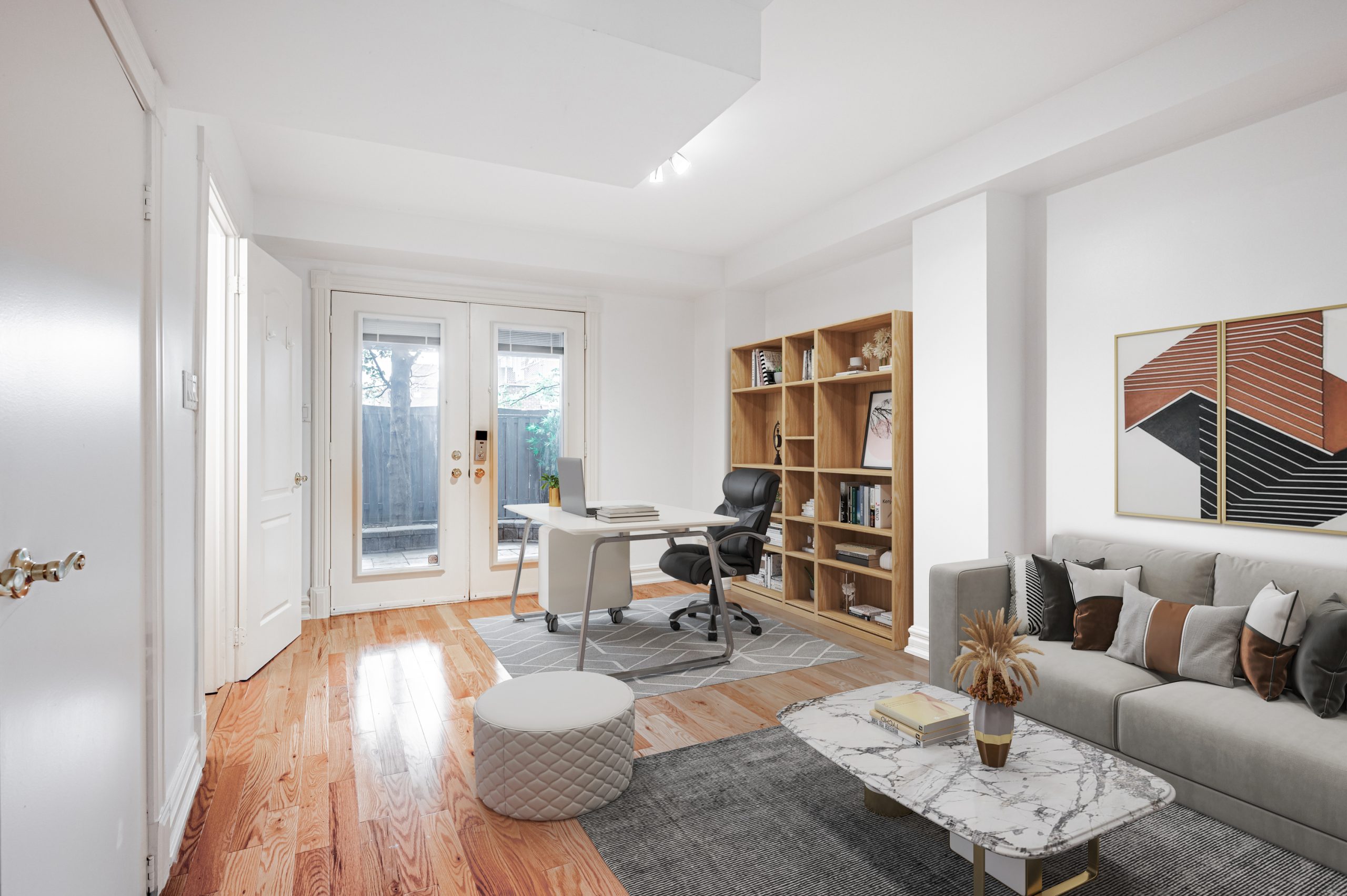 Townhouse living room and den with glossy hardwood floors of stained oak.