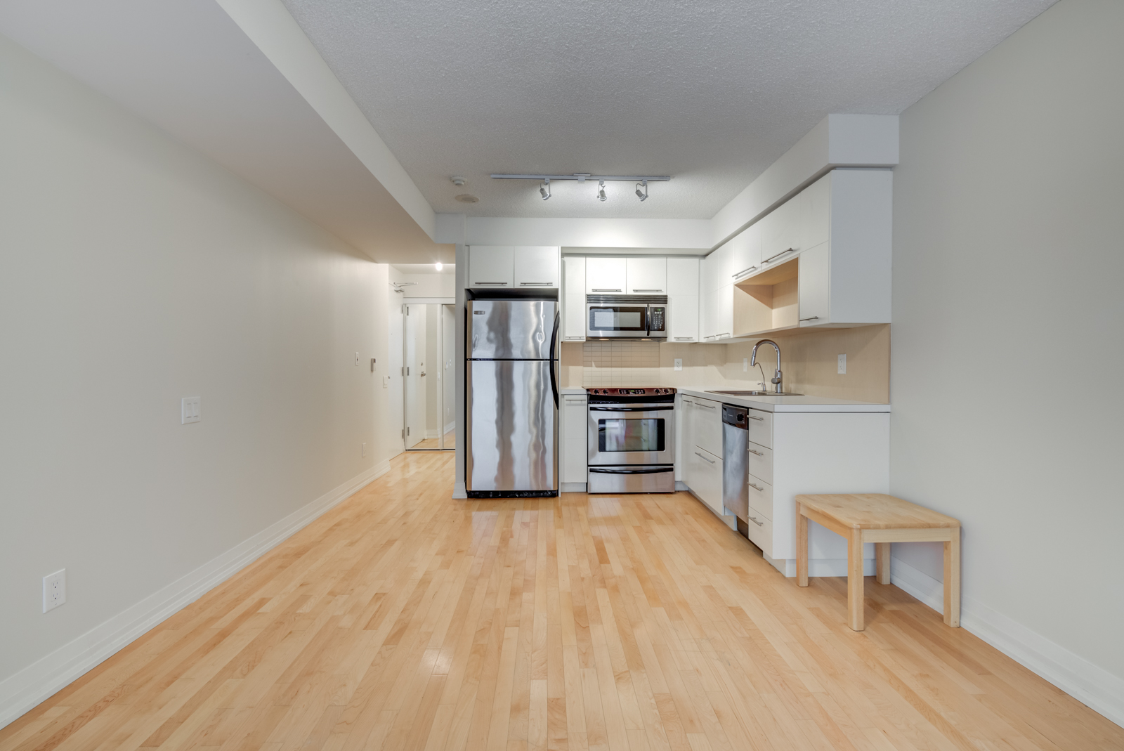 25 Carlton St Unit 401 kitchen and living room