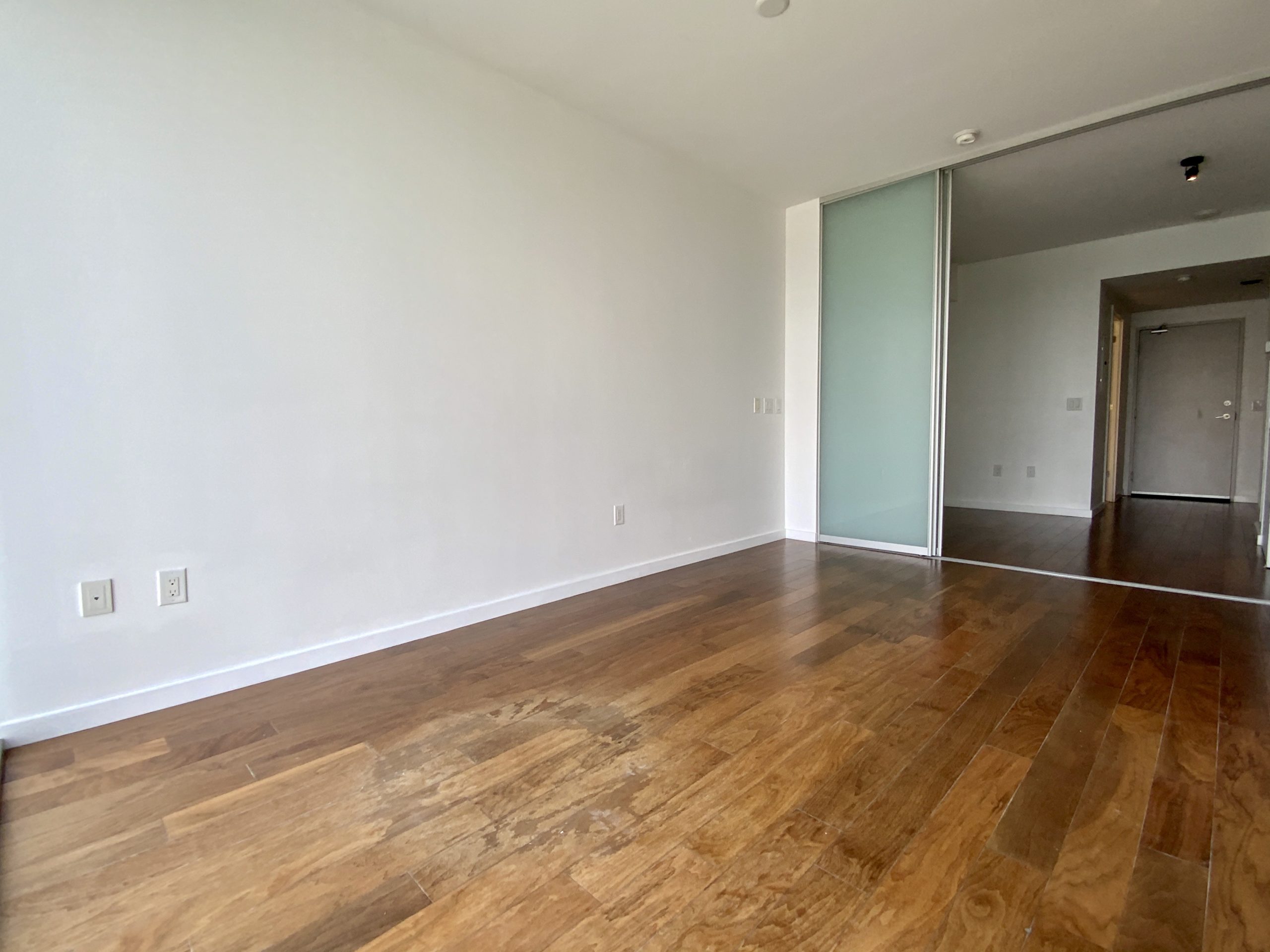 32 Trolley Crescent Unit 803 living room with natural looking laminate floors.