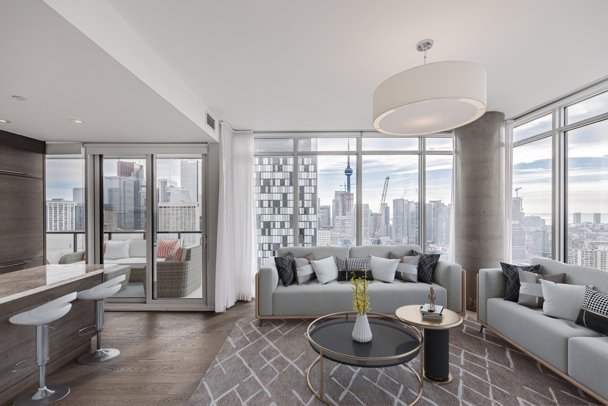 Condo living room with large, circular light-fixture.