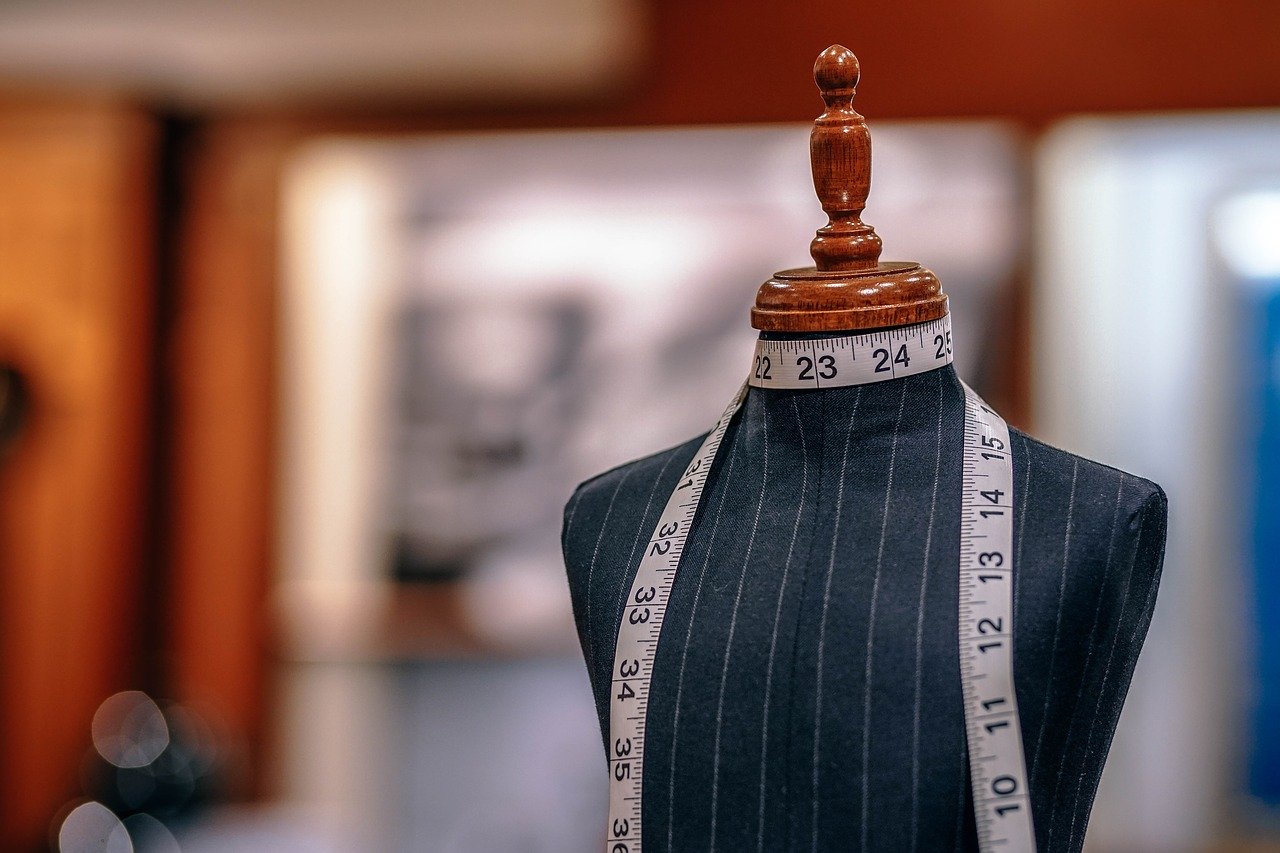 Headless mannequin with tape measure wrapped around collar in Bathurst neighbourhood store.