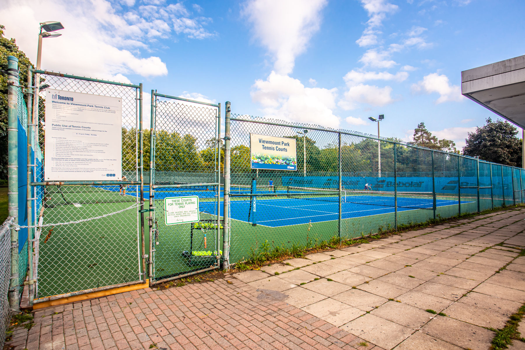 Fence with sign saying Viewmount Park Tennis Court.