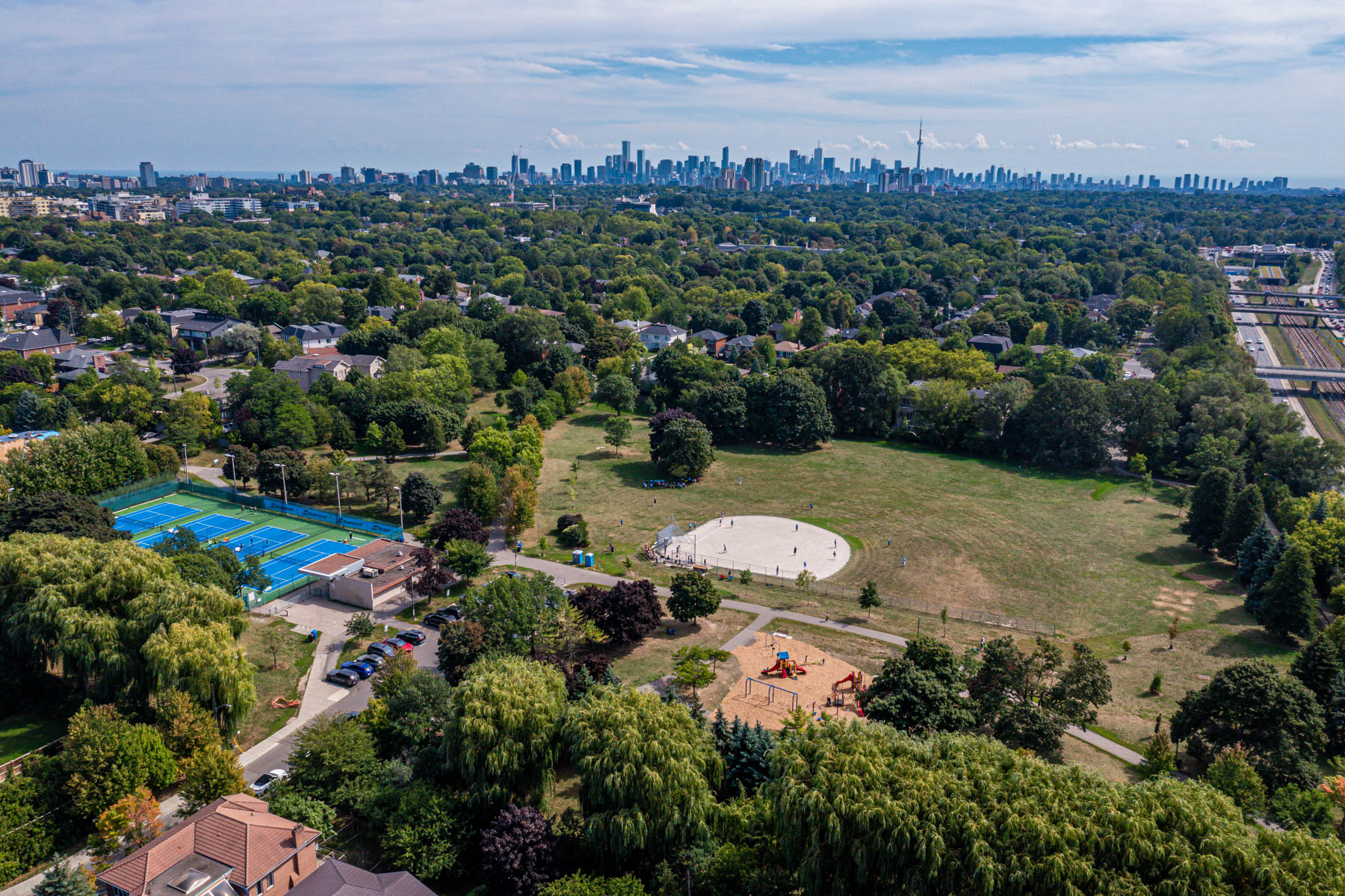 Aerial drone photo of Lawrence Manor neighbourhood with Toronto skyline in distance.
