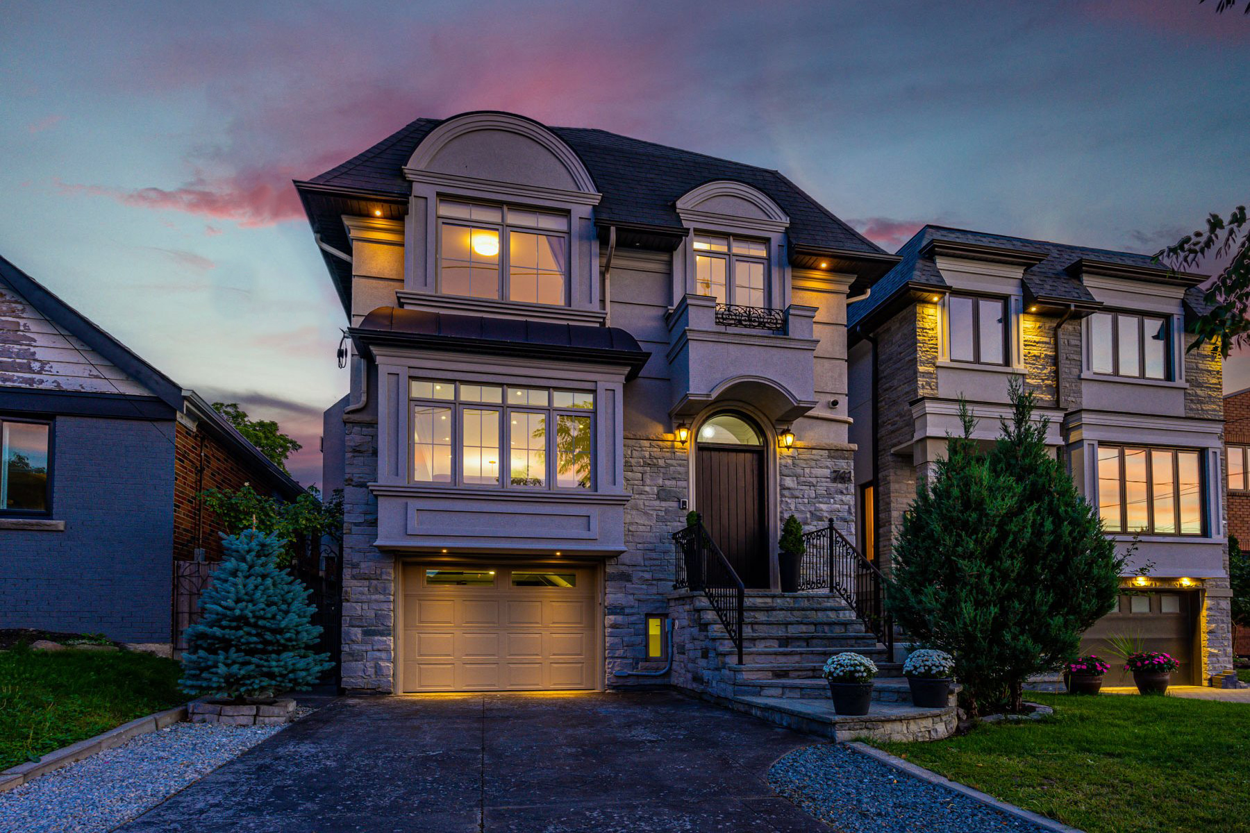 Exterior of 741 Glencairn Ave lit up at night.